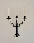 Wrought iron candelabra with wavy arms and a twist detail