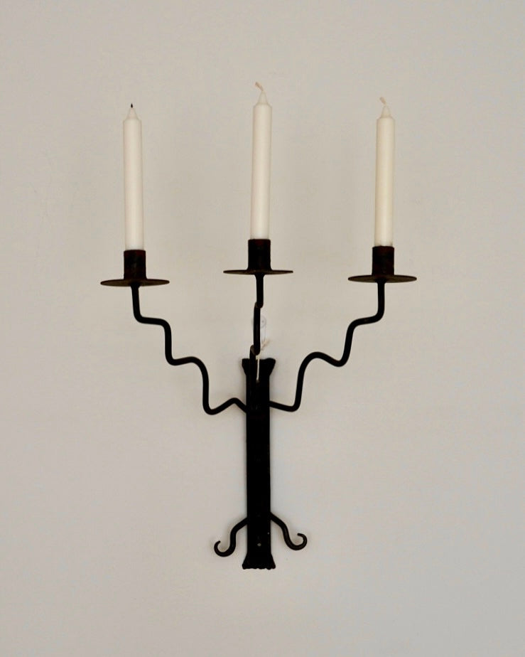 Wrought iron candelabra with wavy arms and a twist detail