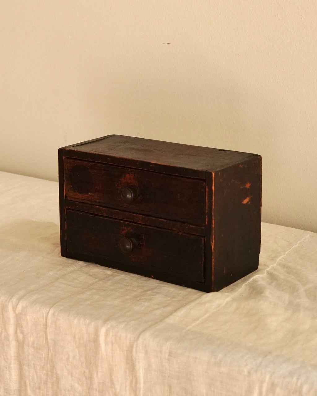 Small wooden chest of drawers
