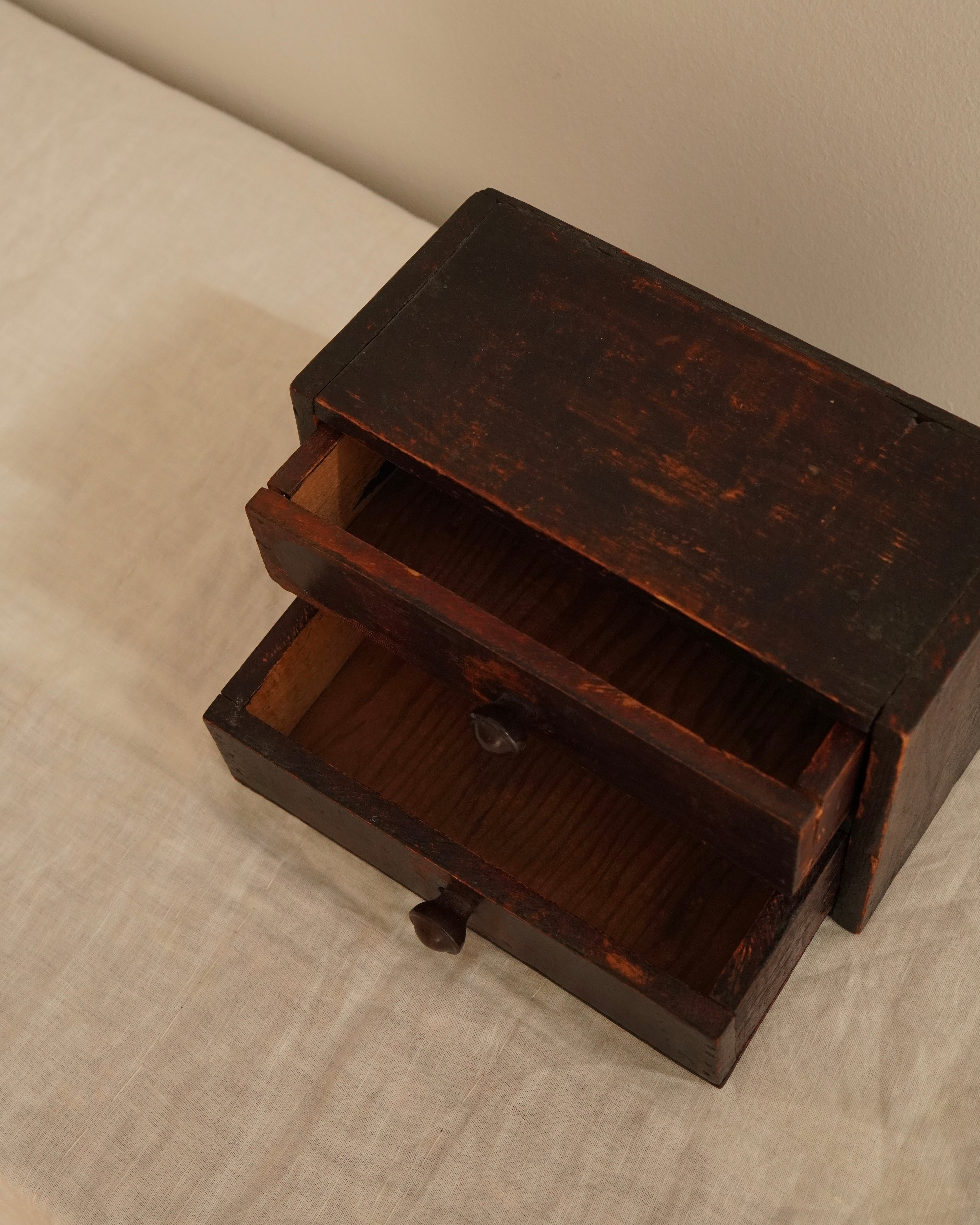 Small wooden chest of drawers