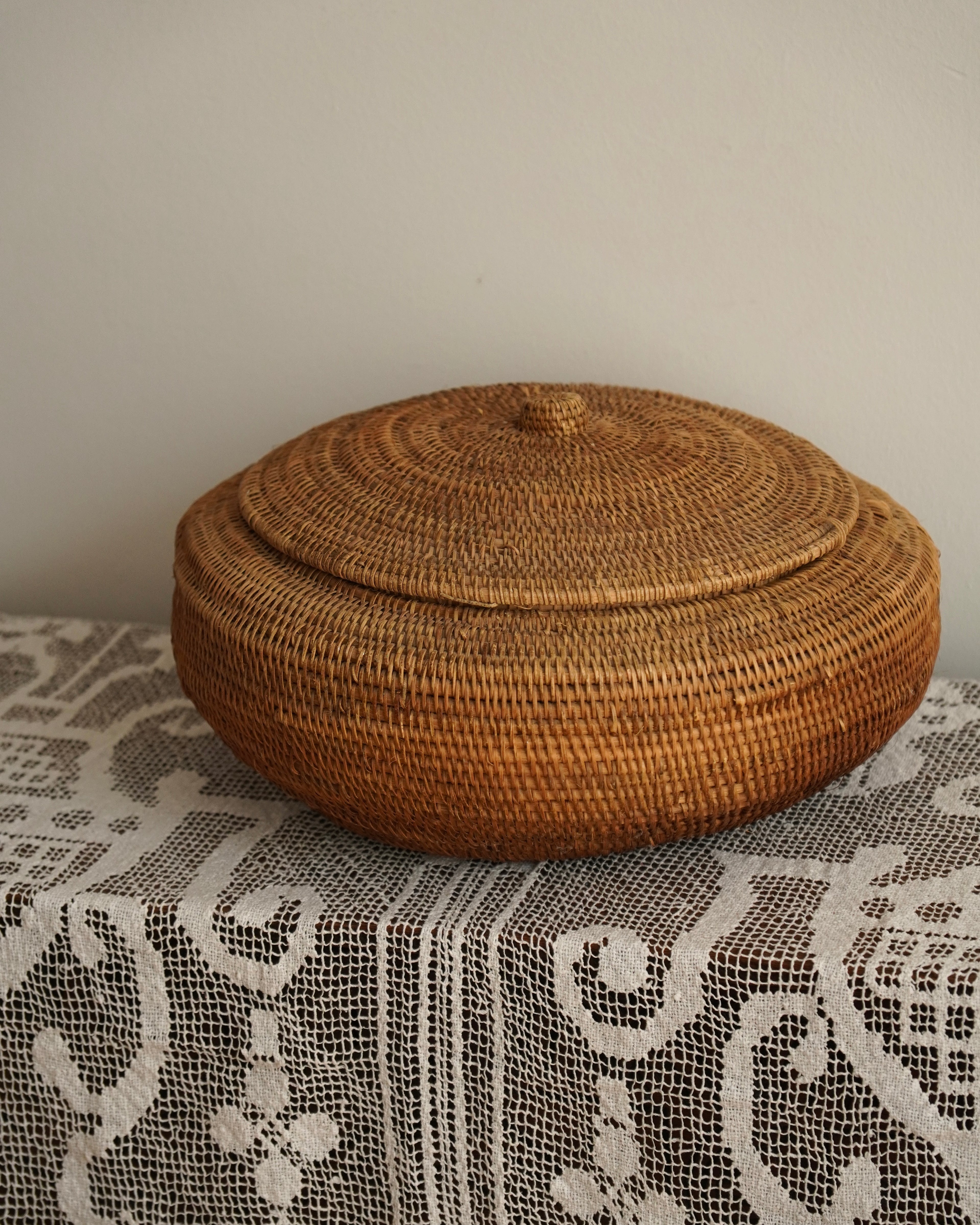 Large woven rattan container with lid