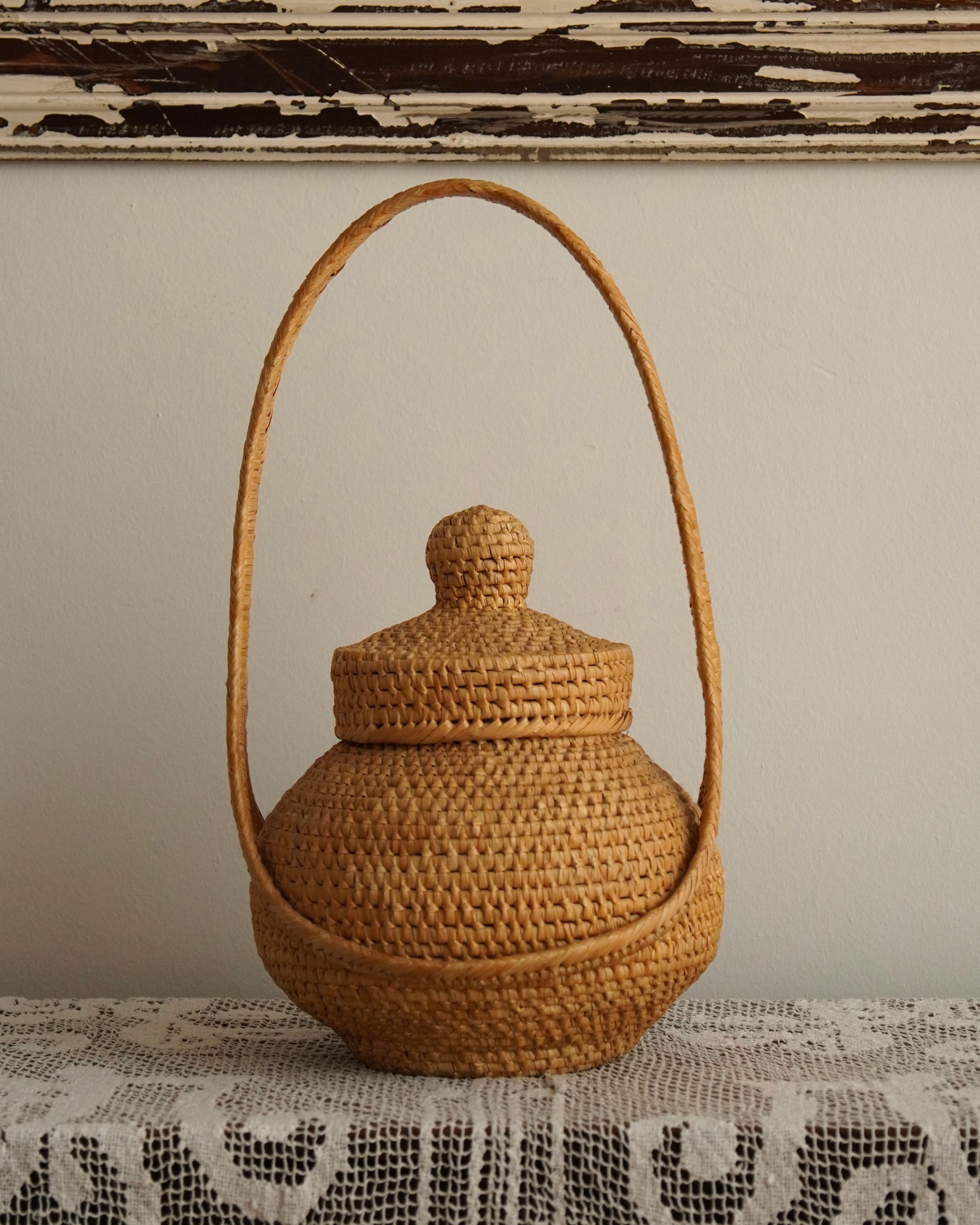 Woven rattan basket with handle and lid