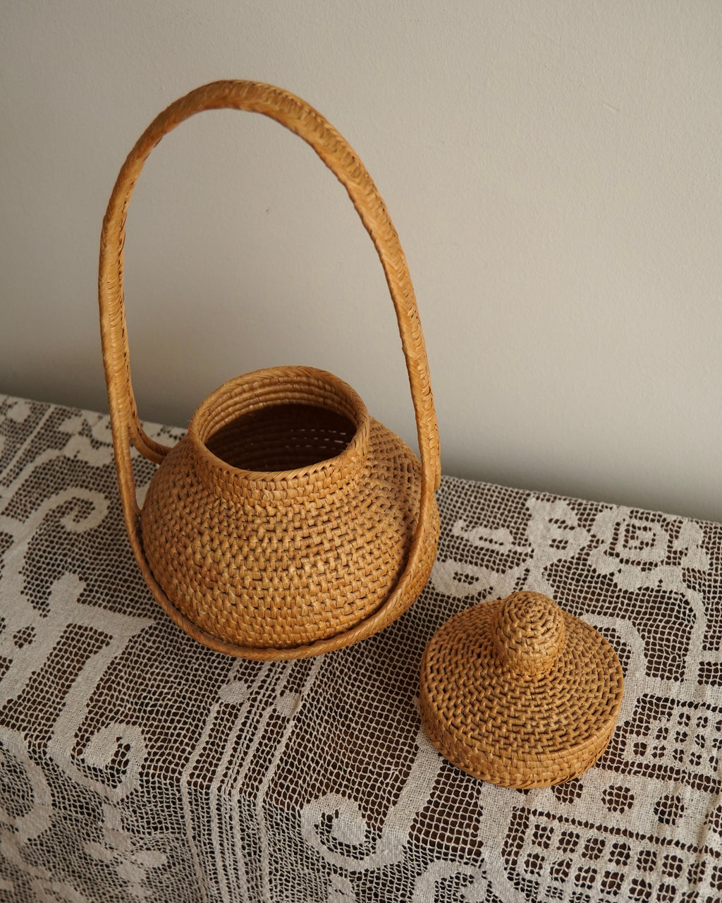 Woven rattan basket with handle and lid