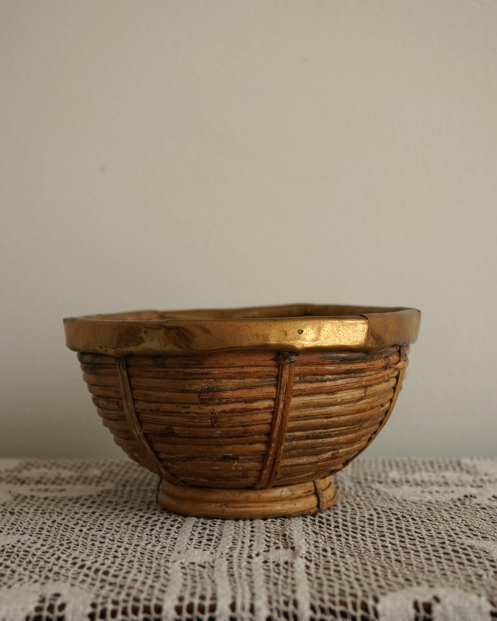 Brass trim and woven rattan bowl likely by Gabriella Crespi