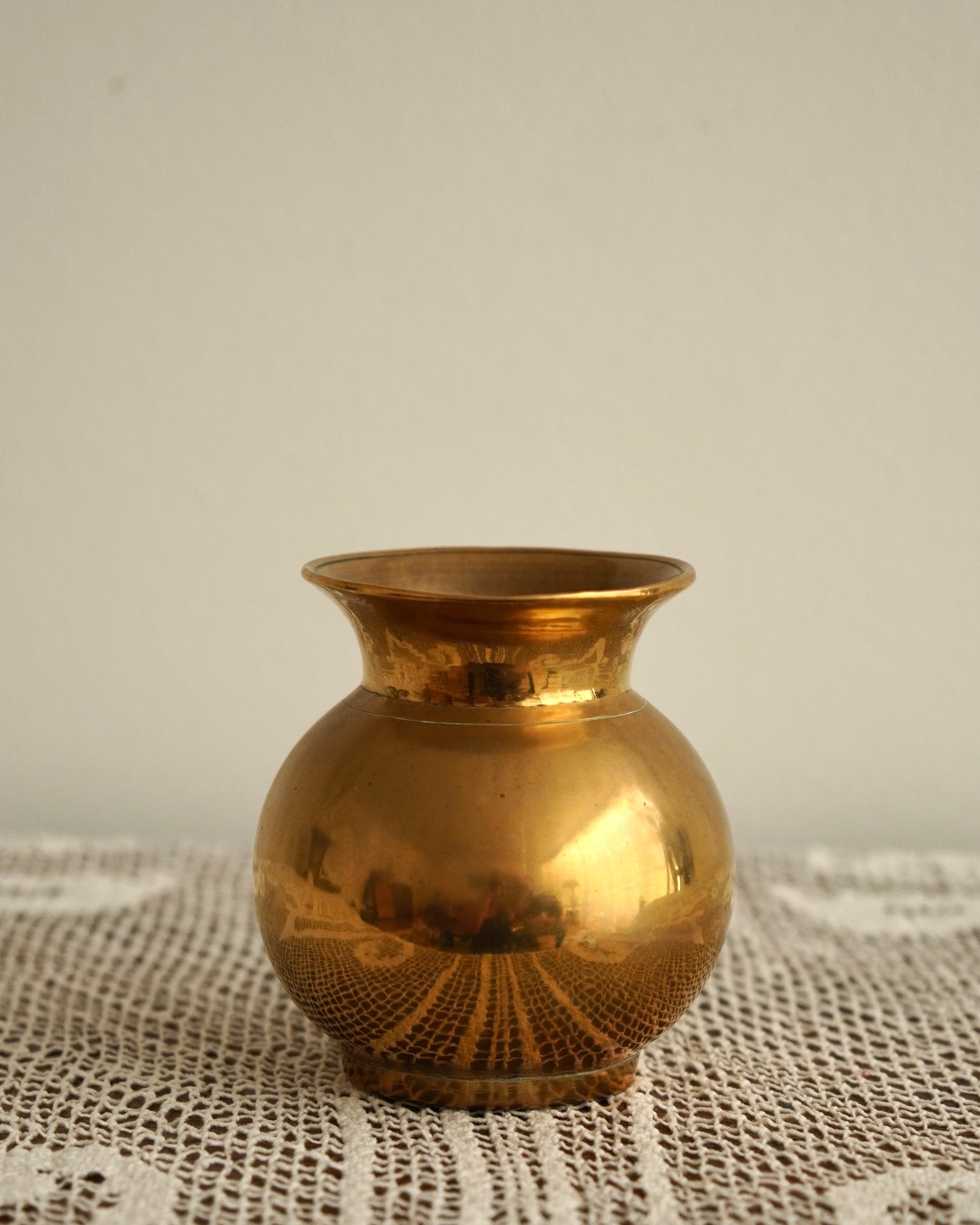 Short rounded solid brass vase