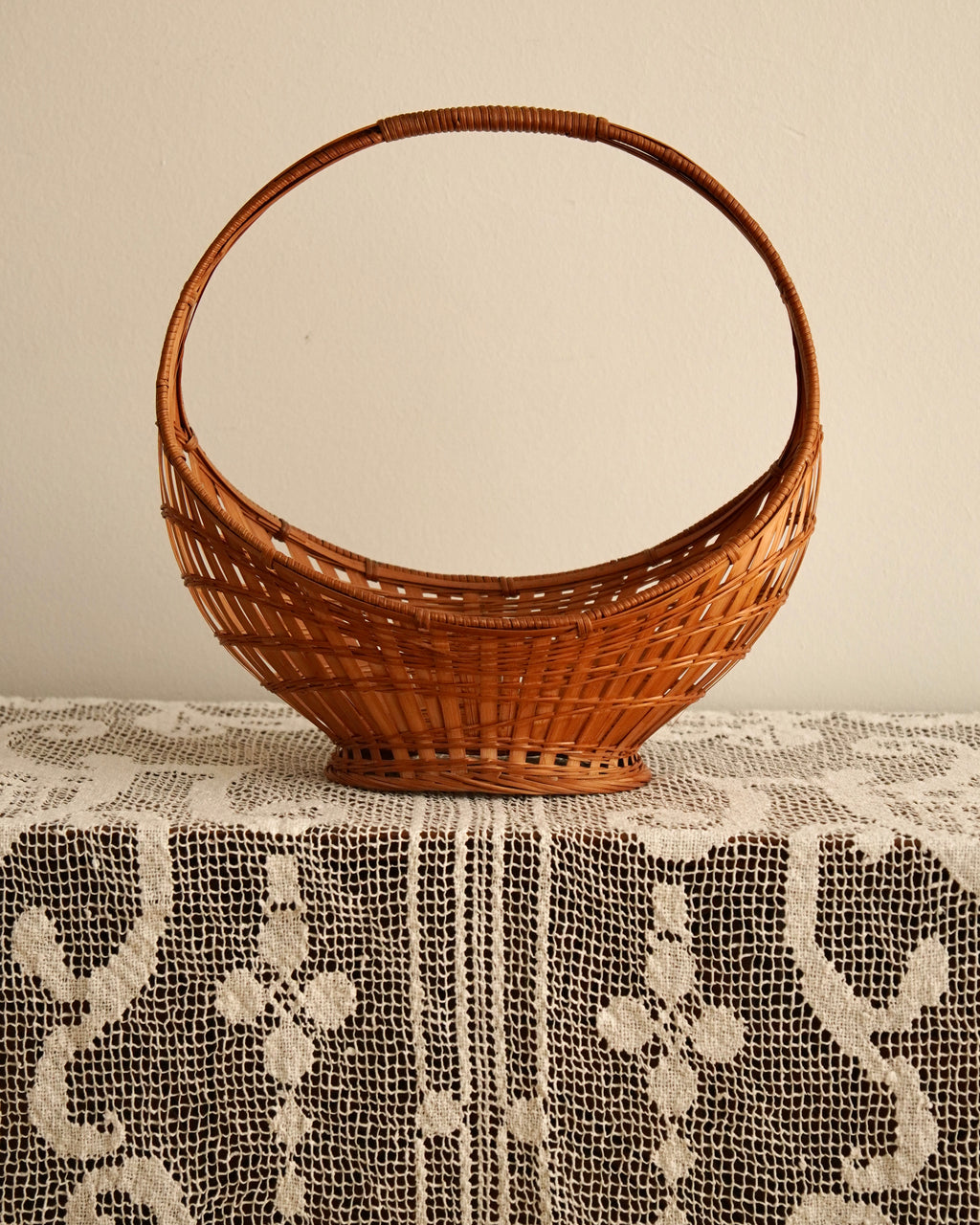 Woven rattan basket with handle