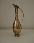 Tall brass vase with handle and tapered neck