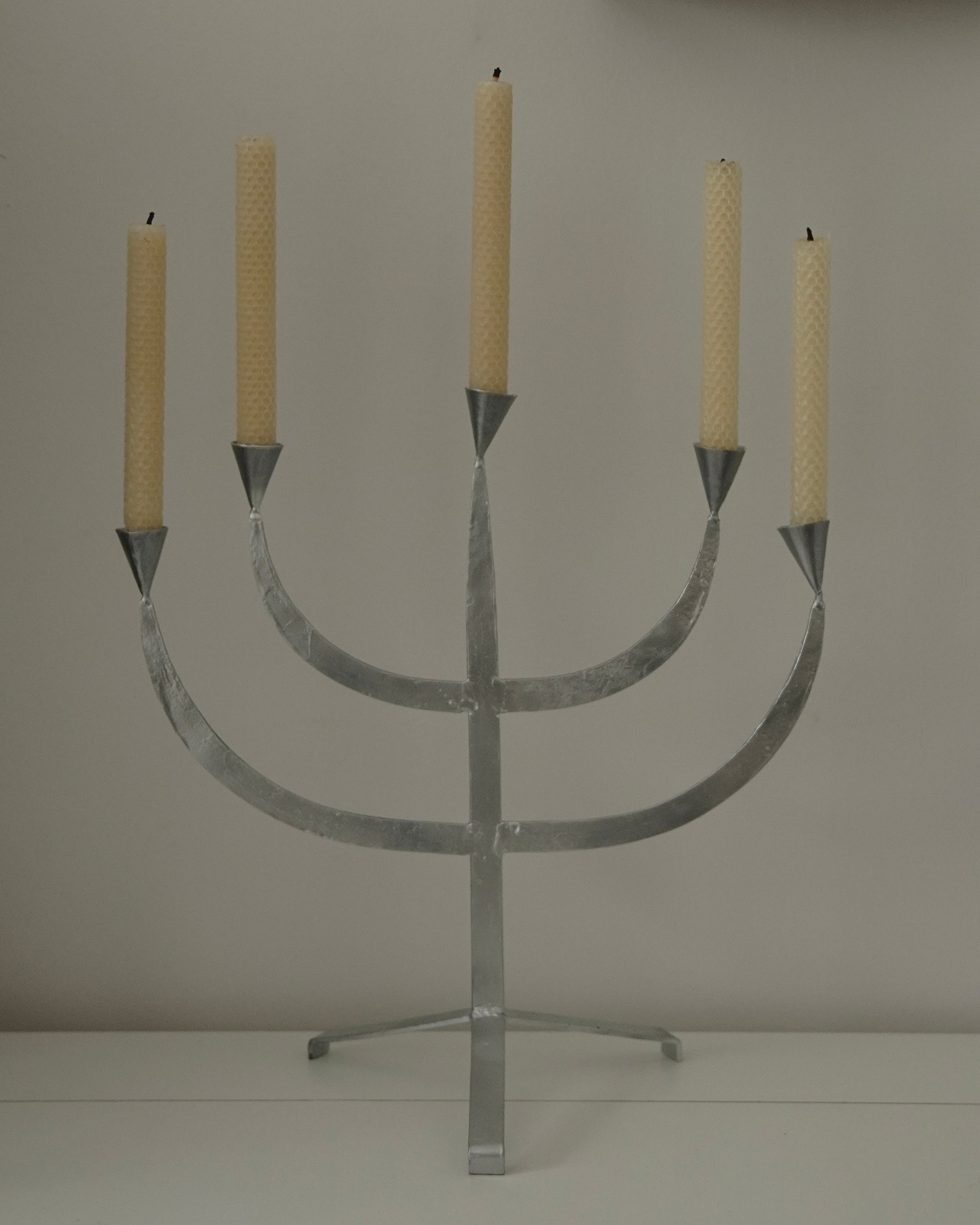 Silver coloured metal candelabra, holds 5