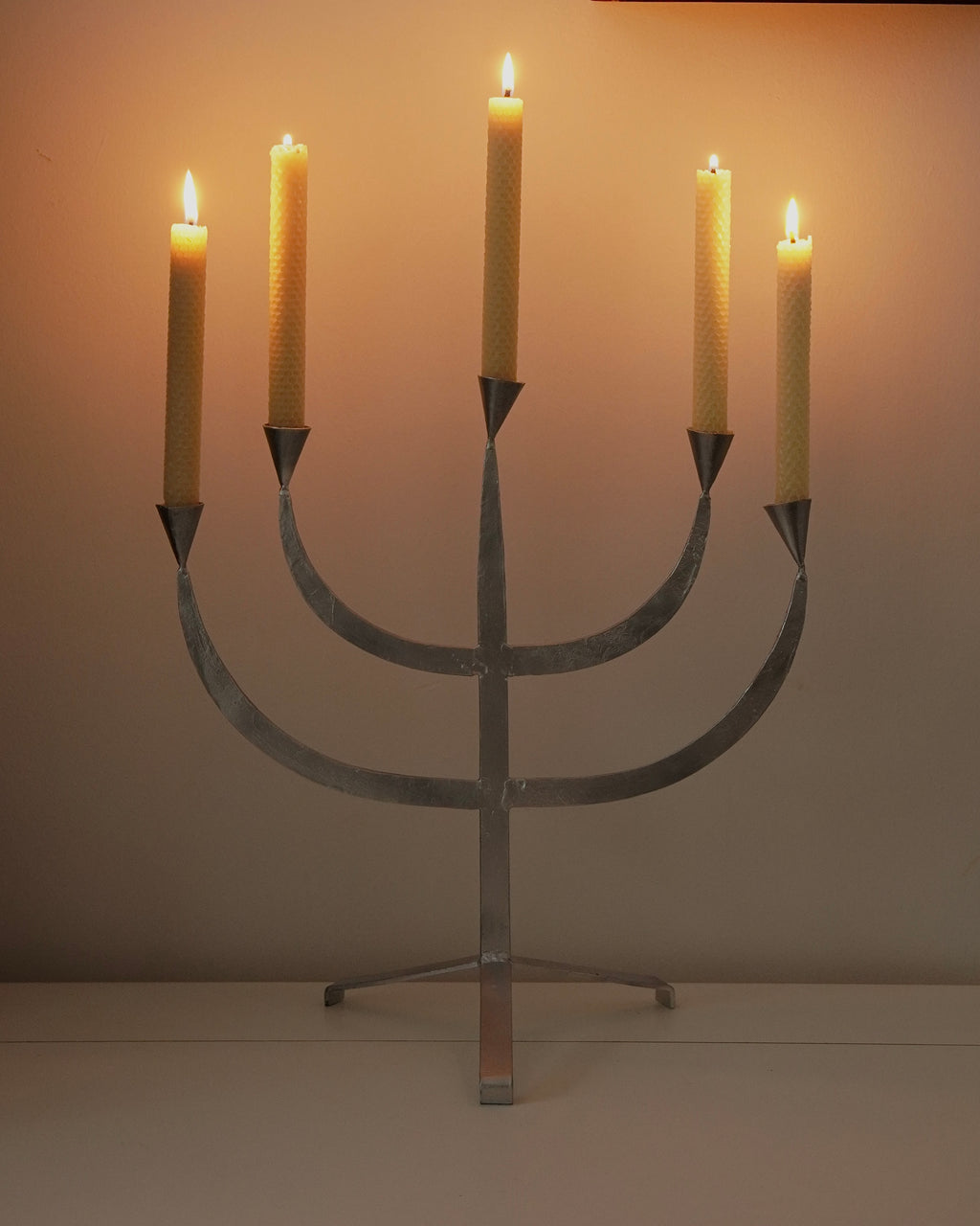 Silver coloured metal candelabra, holds 5