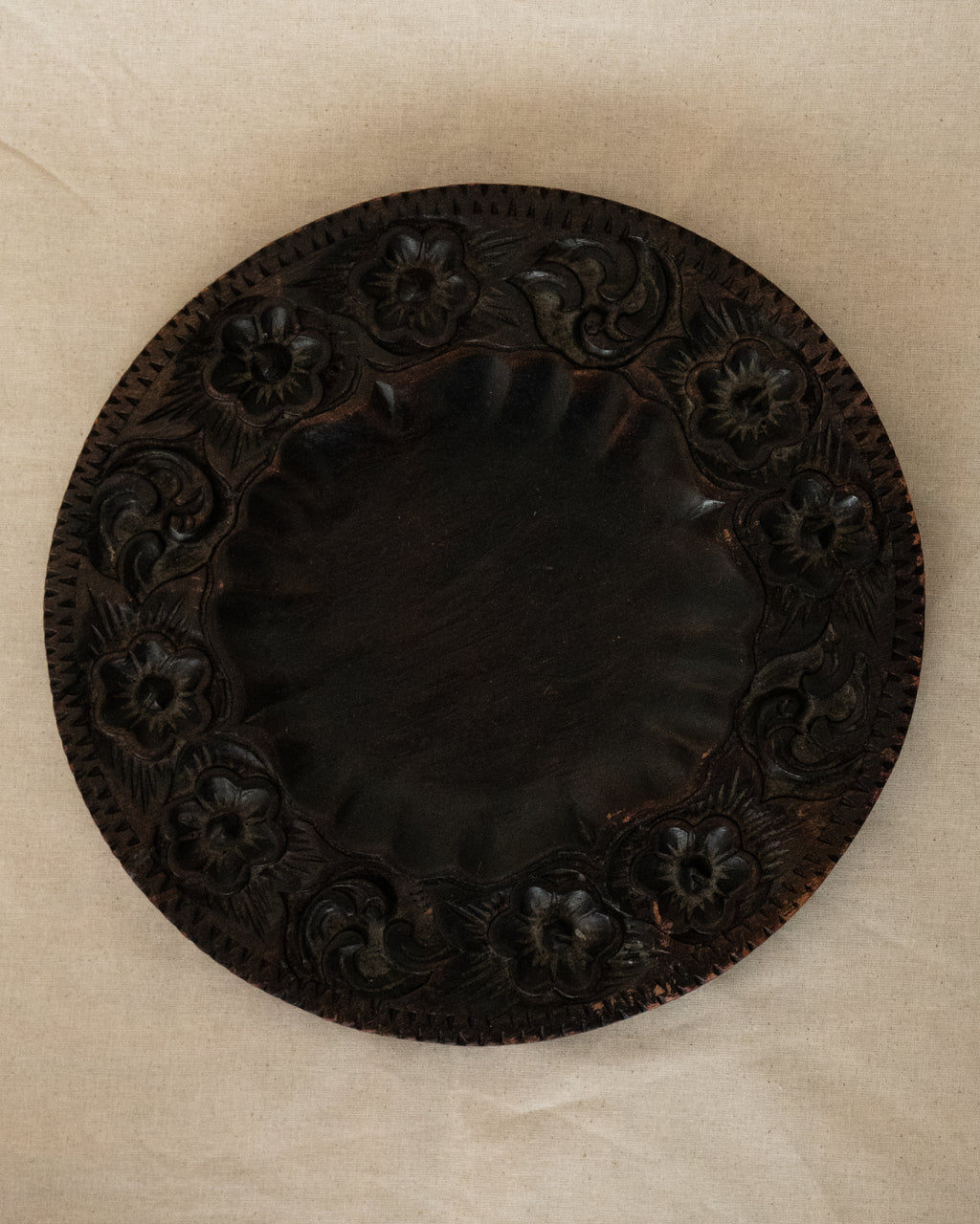 Dark wooden plate/tray/wall decor with floral carvings
