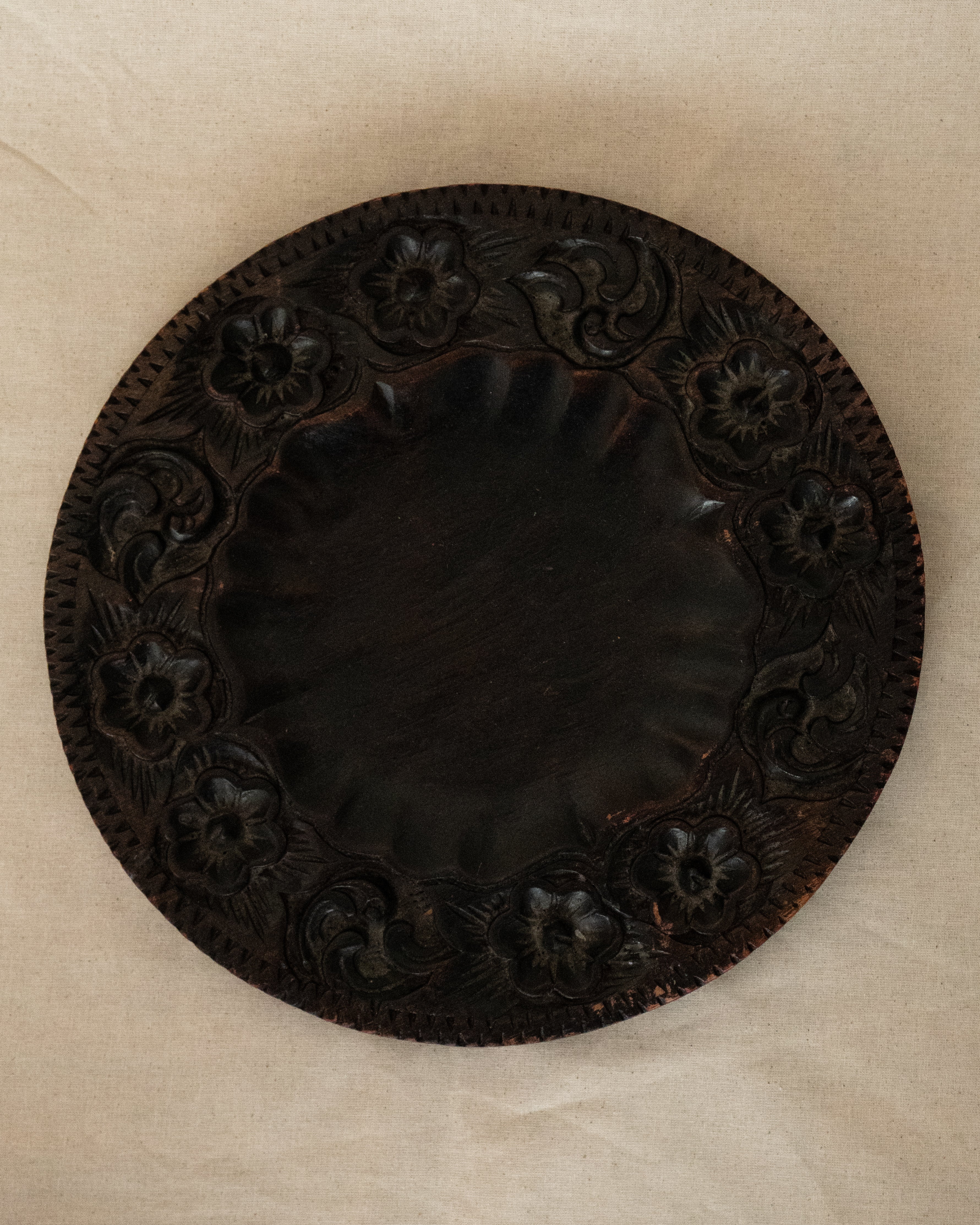 Dark wooden plate/tray/wall decor with floral carvings