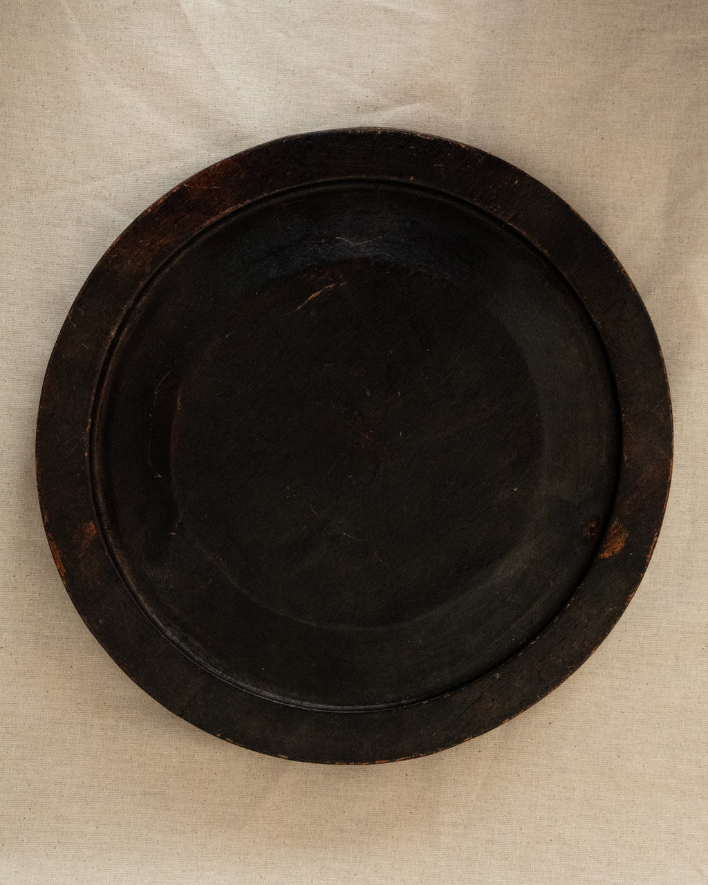 Dark wooden plate/tray/wall decor with floral carvings
