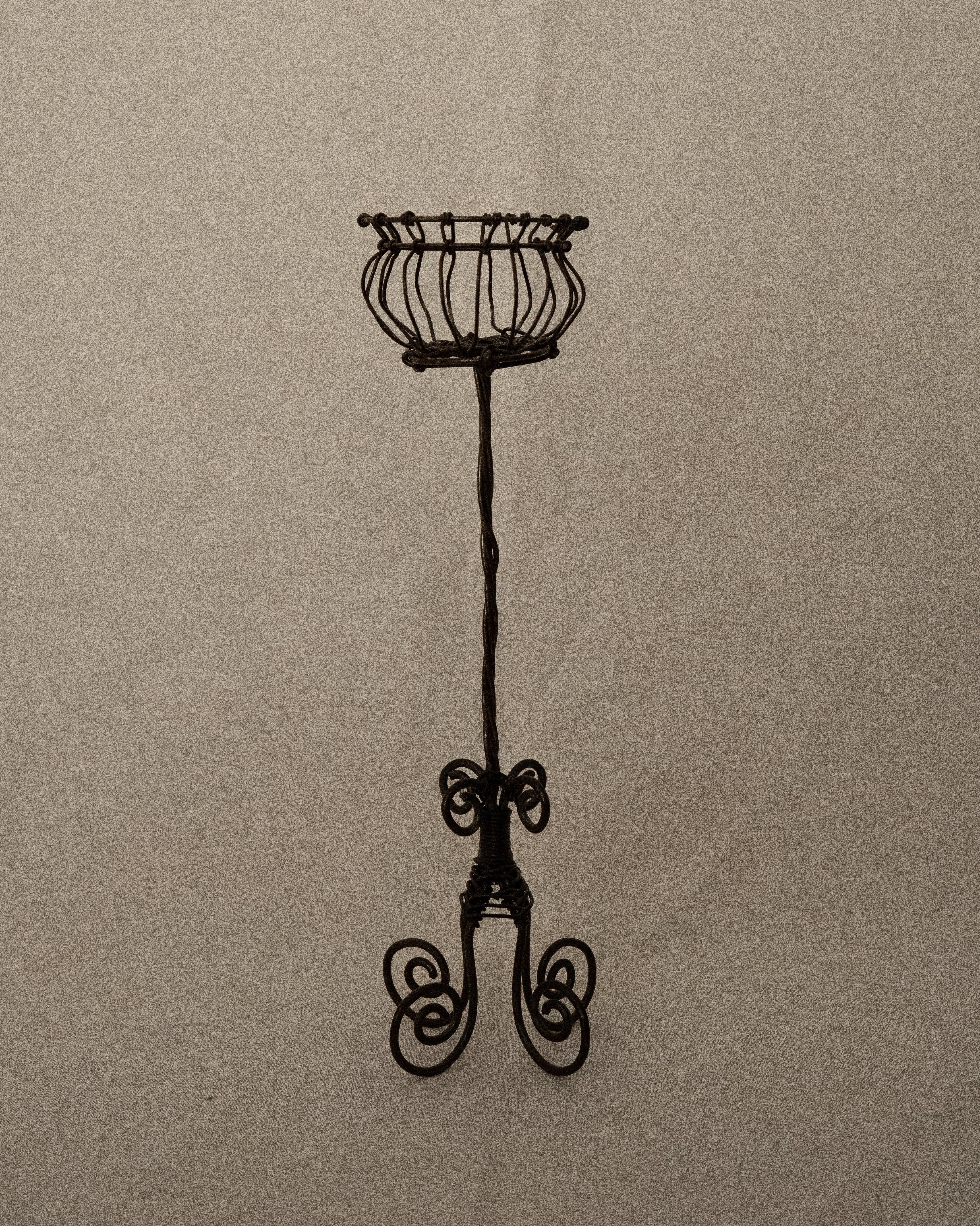 Wrought iron candle holder with spiral feet, holds 1 pillar candle