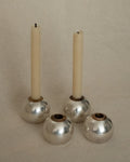 Set of 4 silver and brass round single candle holders