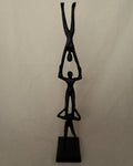 Trio of acrobats metal sculpture in black