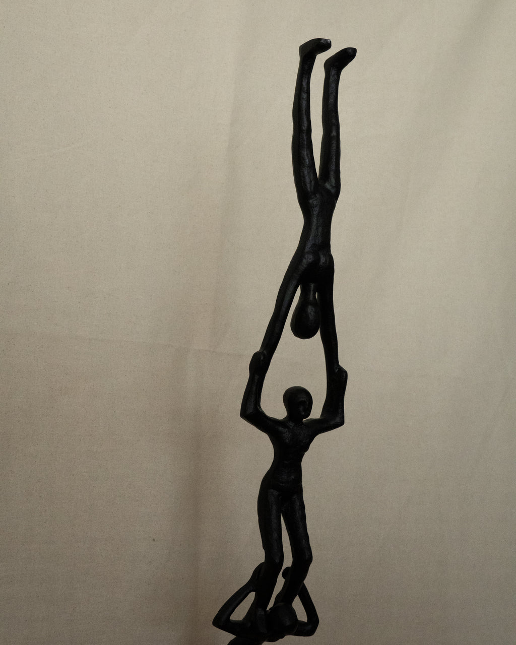 Trio of acrobats metal sculpture in black