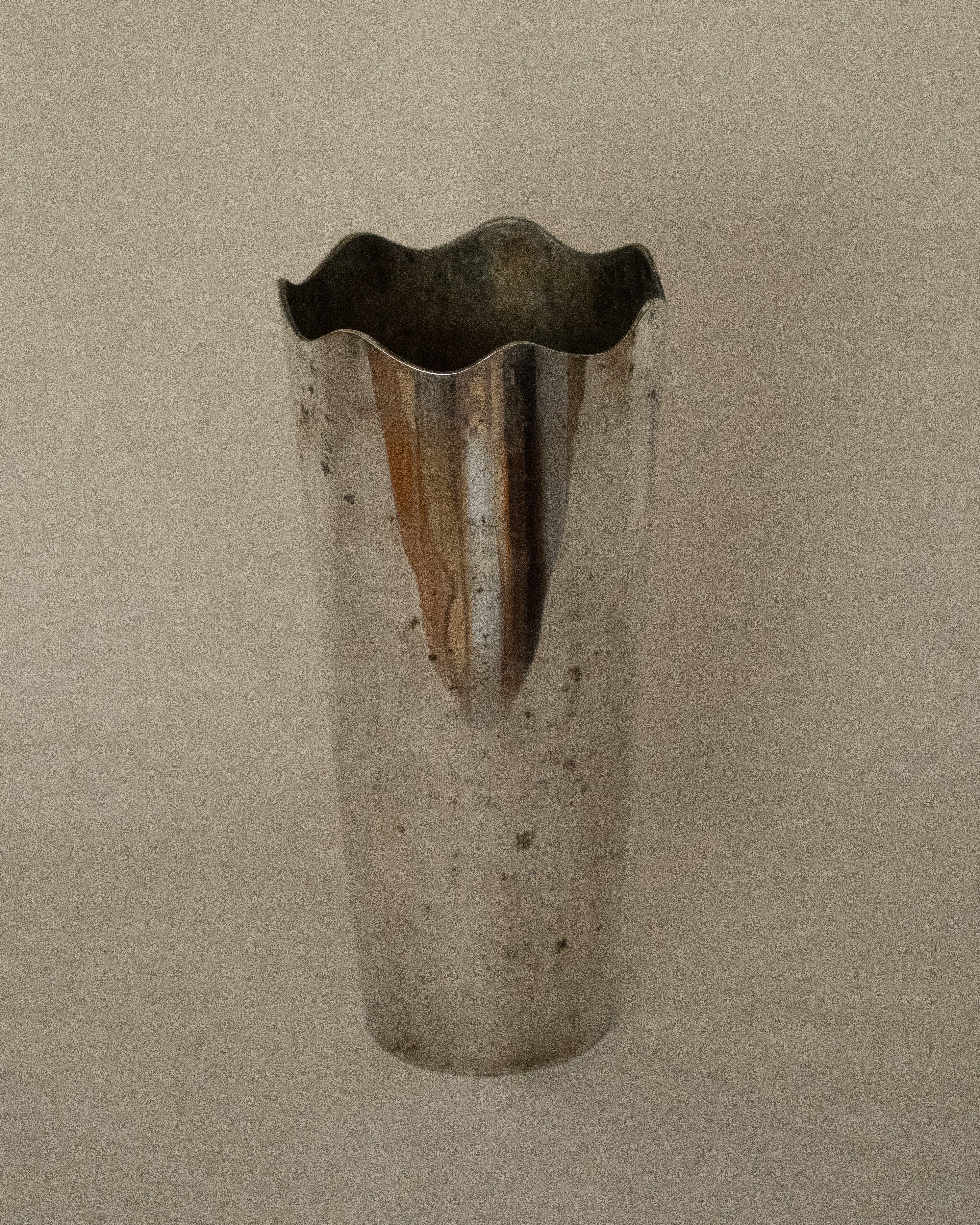 Silver plated vase with wavy opening