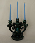Green ceramic candelabra with rainbow lustre glaze, holds 3