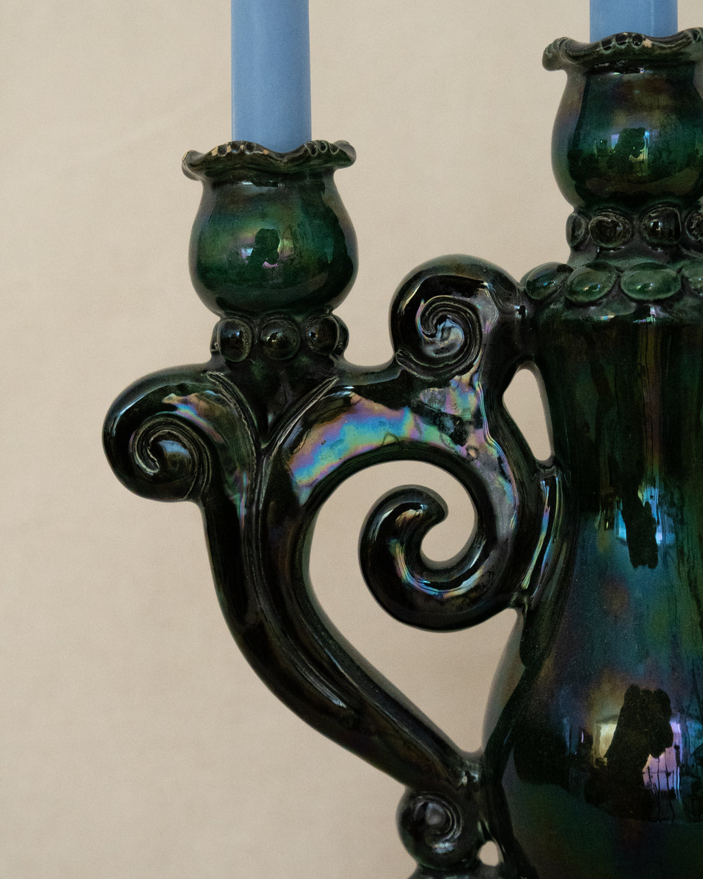 Green ceramic candelabra with rainbow lustre glaze, holds 3