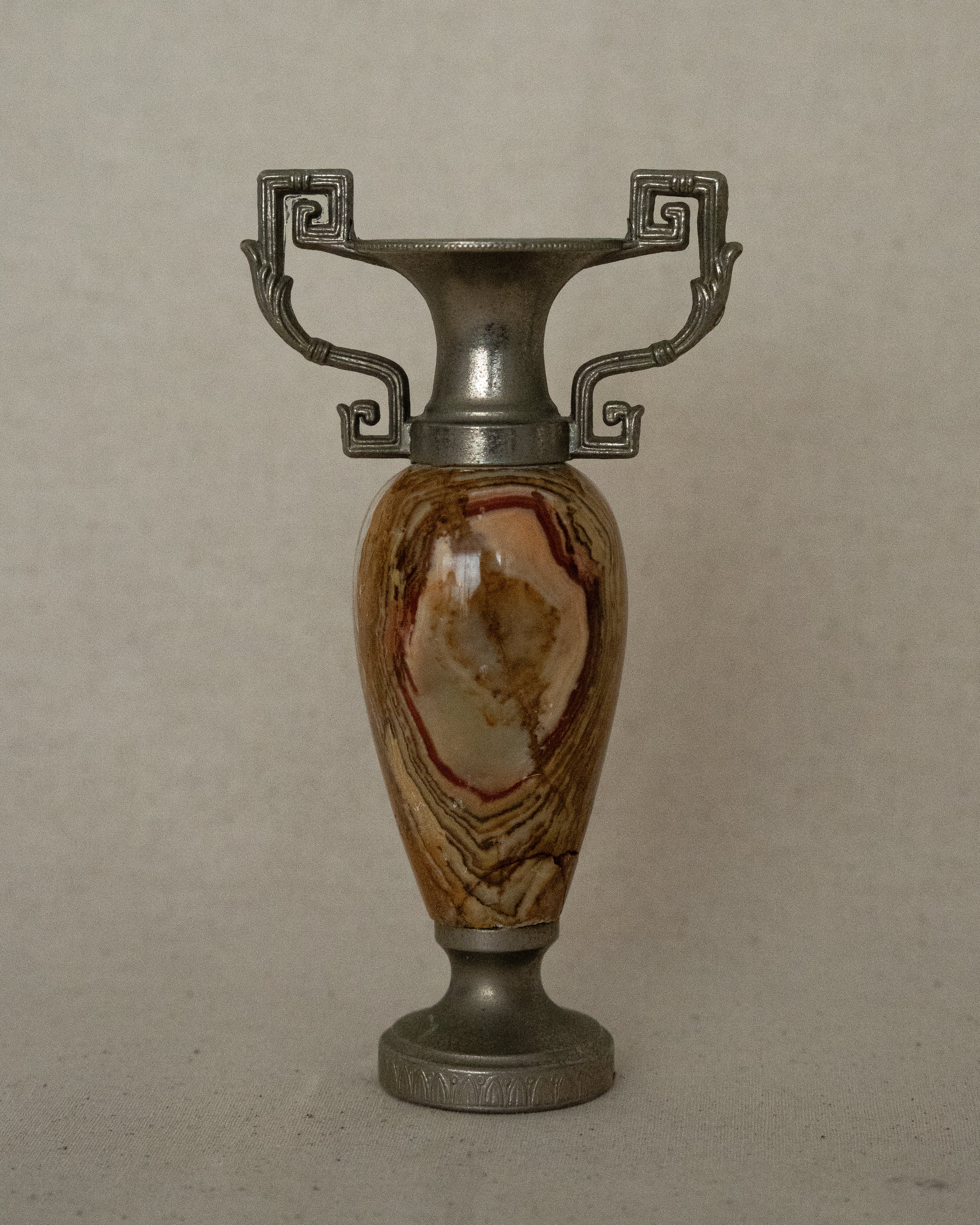 Small stone urn single stem vase with intricate handles (orange)