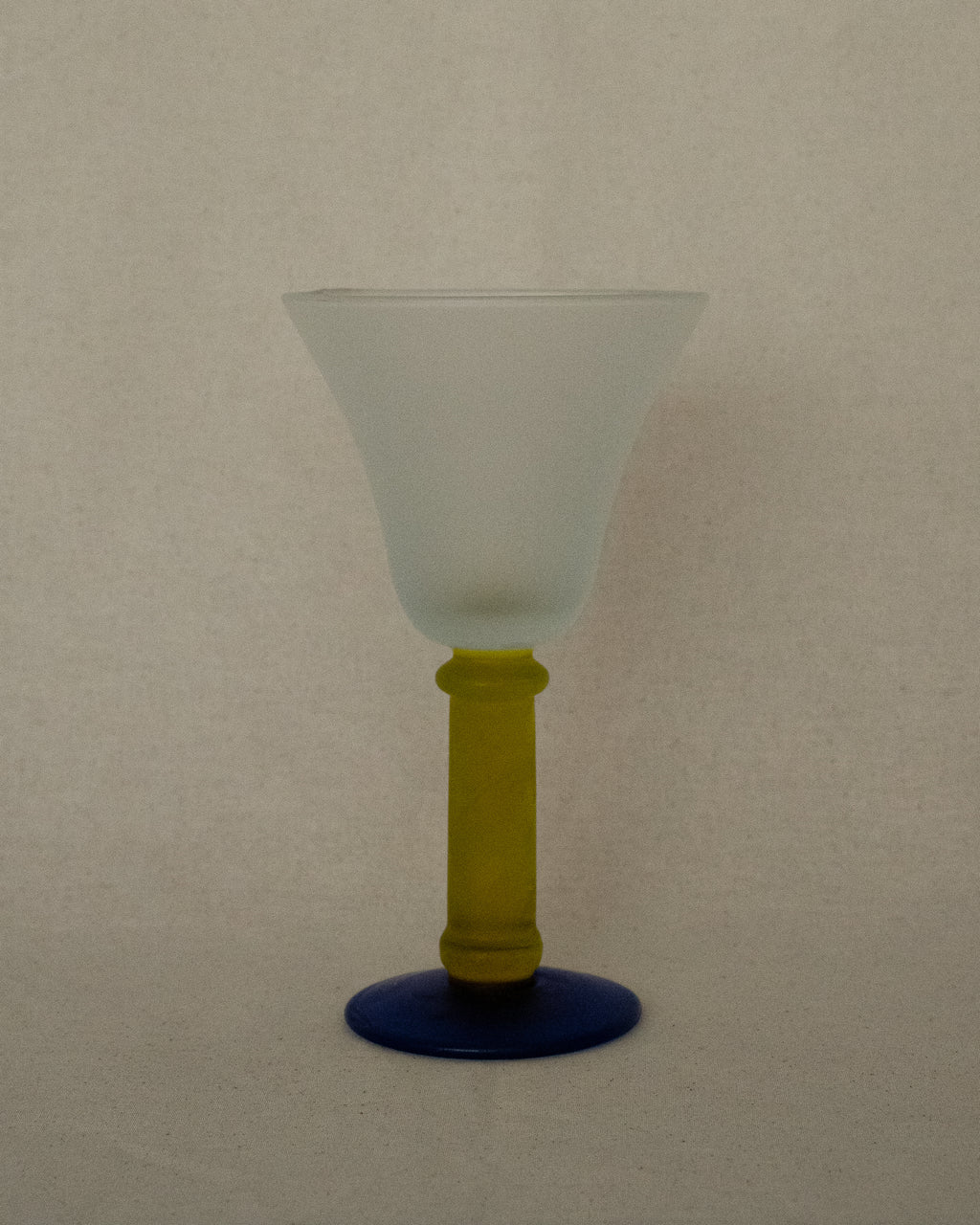 Translucent green and blue wine glass