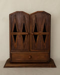 Wooden gothic style cabinet with shelving, two doors and a drawer