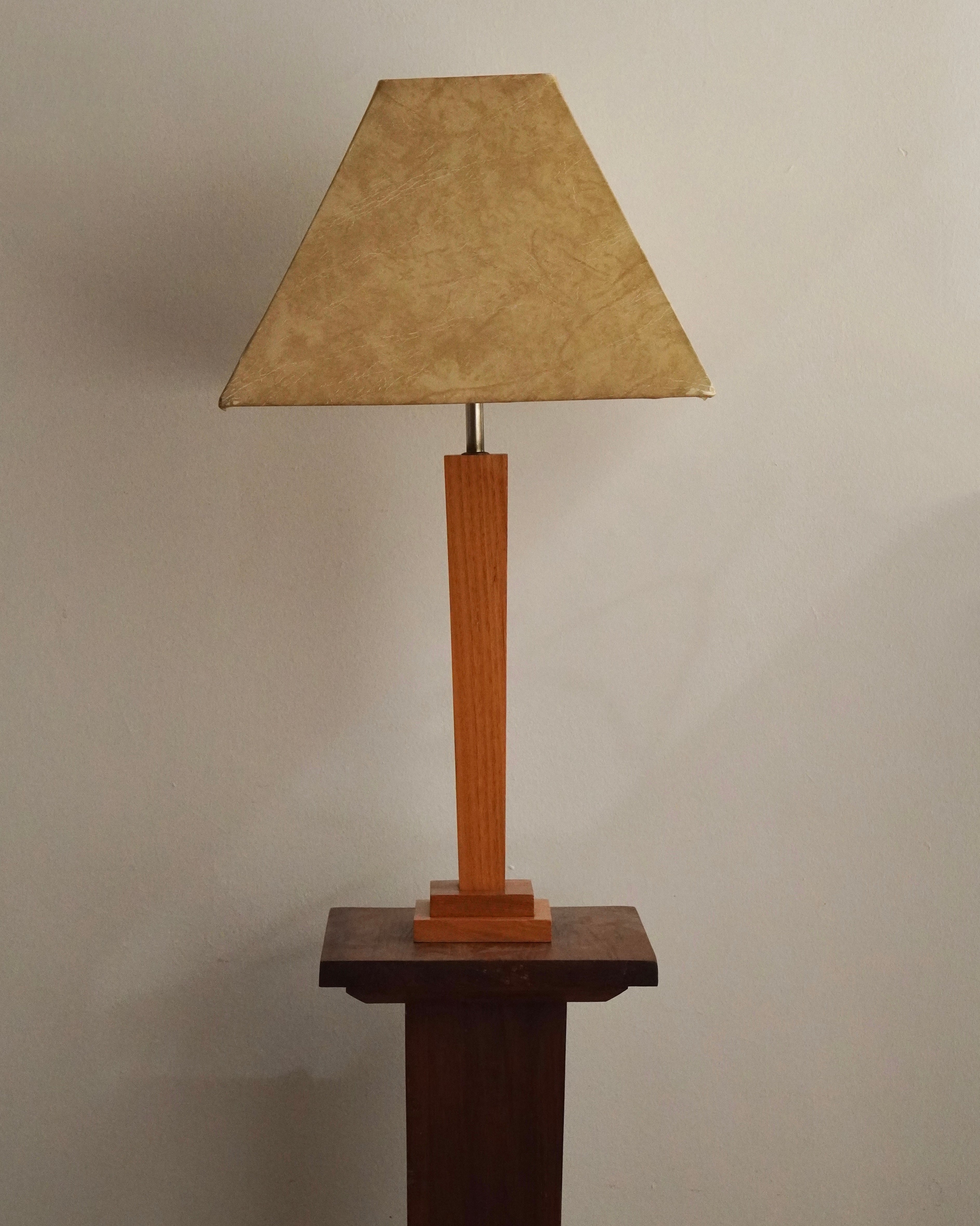 Art deco style lamp with faux leather like lampshade, tapered body square stepped base