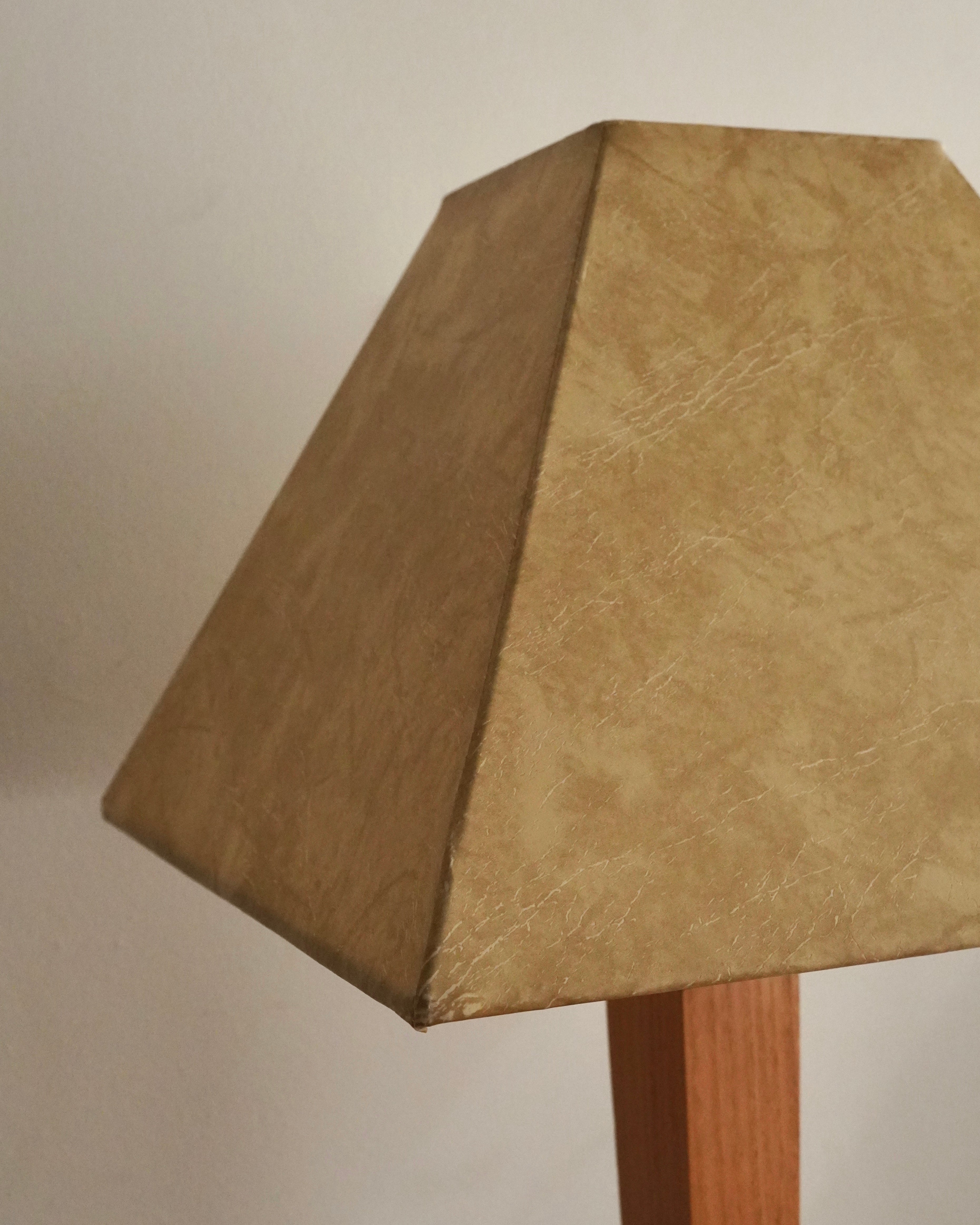 Art deco style lamp with faux leather like lampshade, tapered body square stepped base