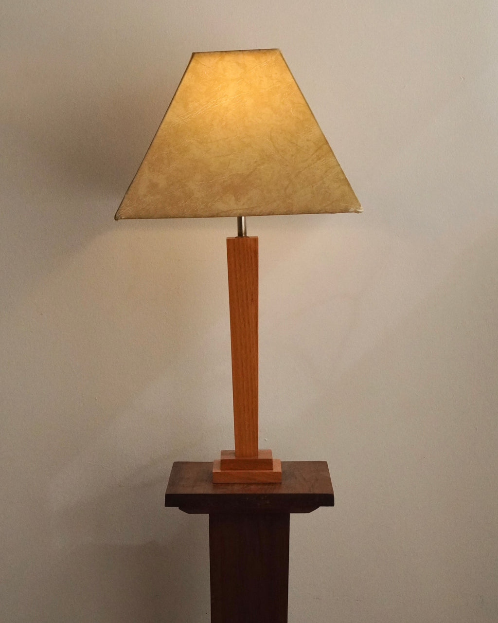 Art deco style lamp with faux leather like lampshade, tapered body square stepped base