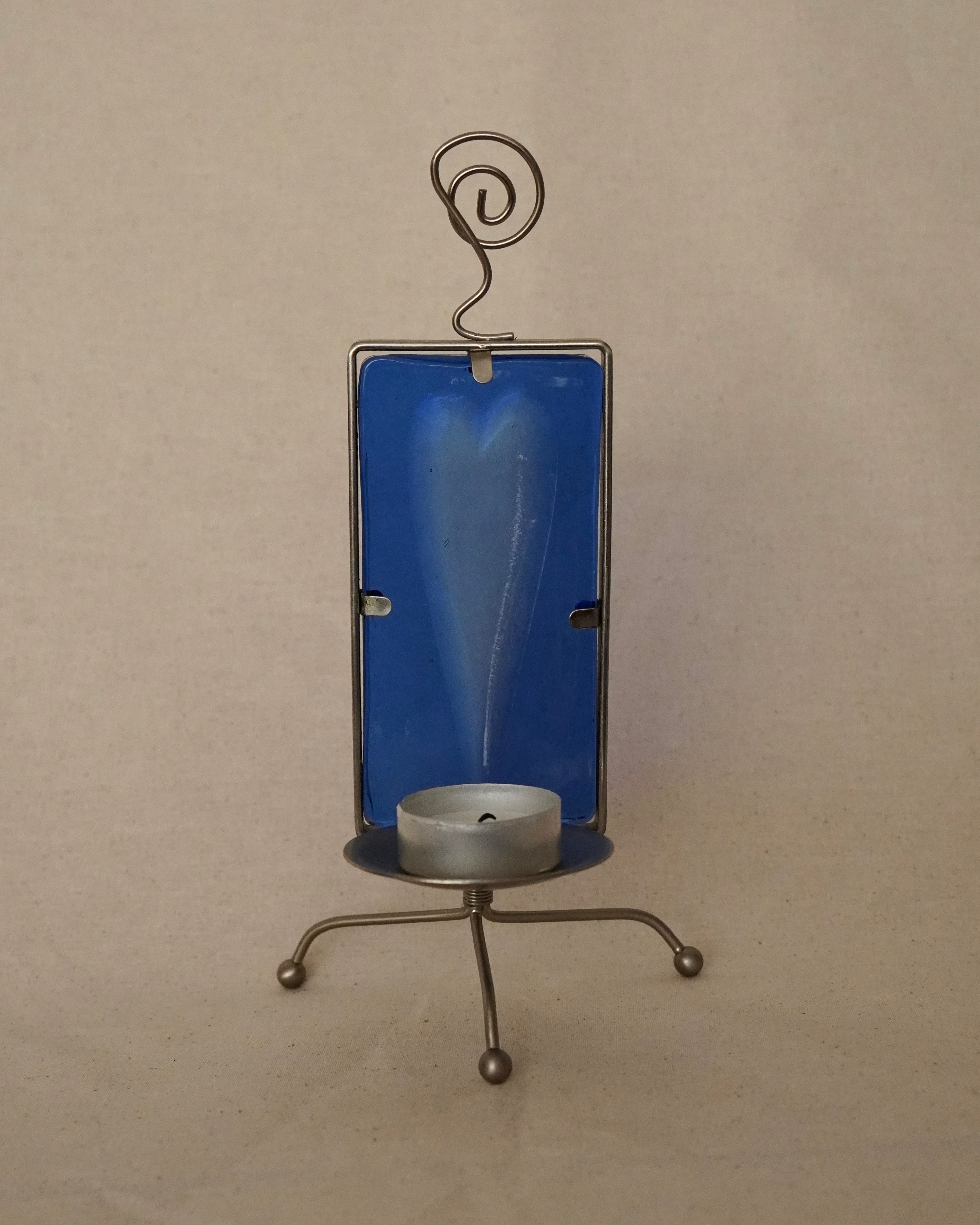 Heart shaped indent blue glass and metal tealight candle holder