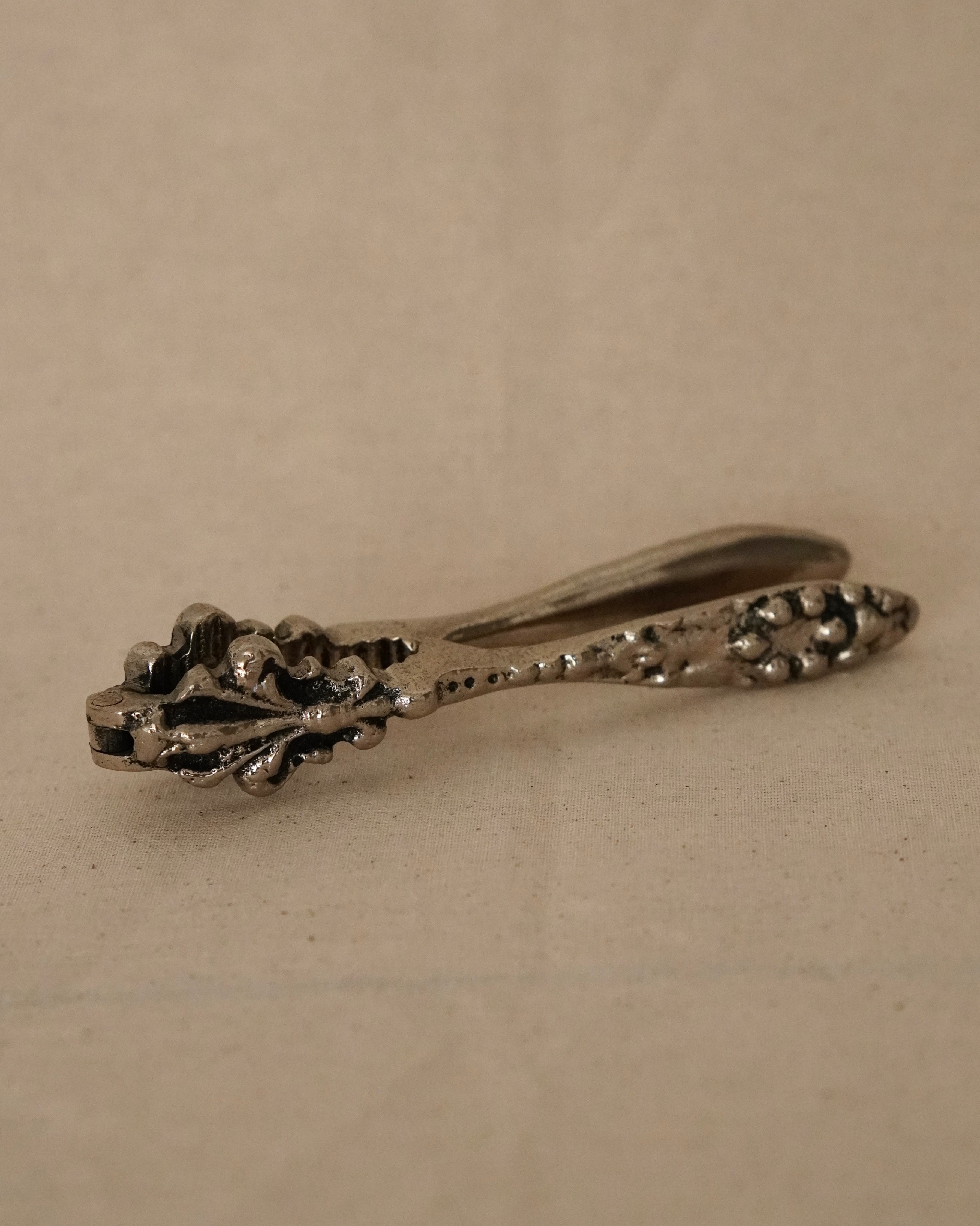 Solid metal nut cracker