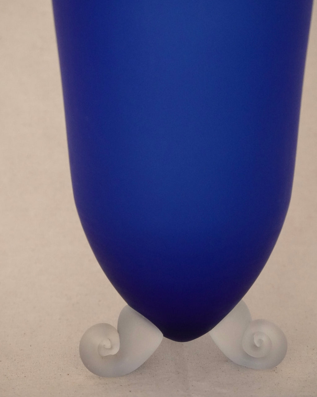 Blue art glass vase with spiral feet