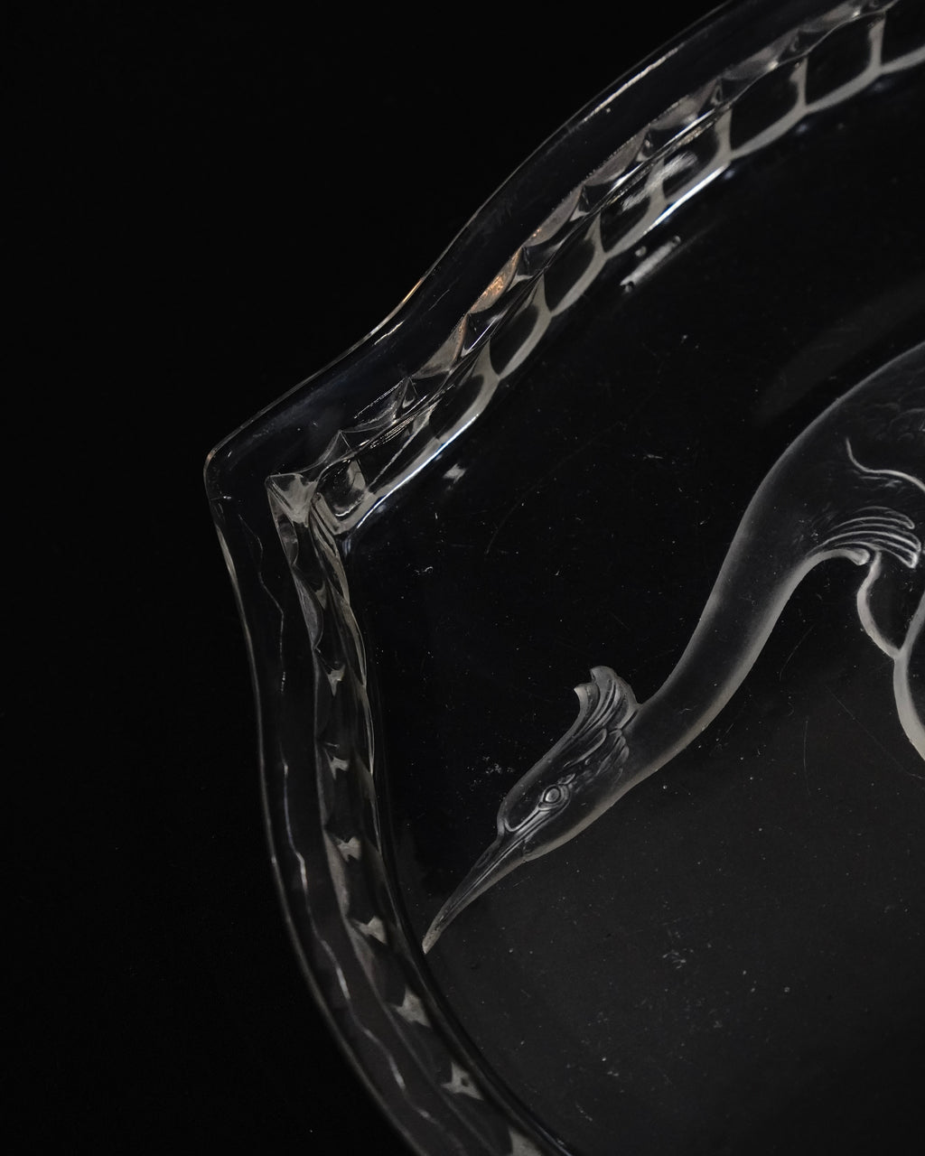 Glass tray with carved out crane