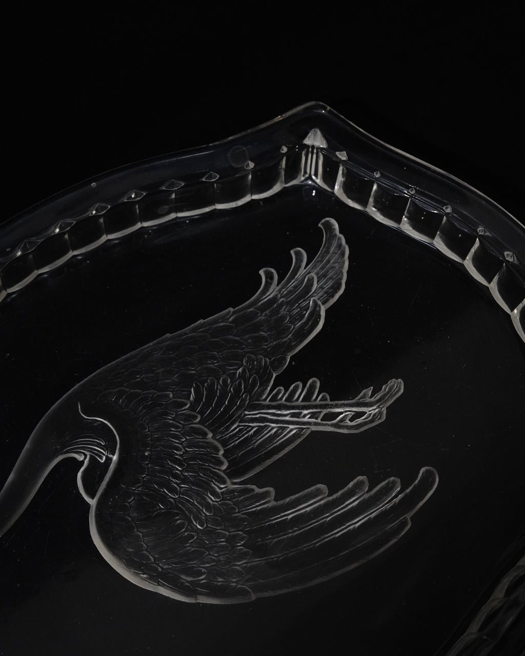 Glass tray with carved out crane