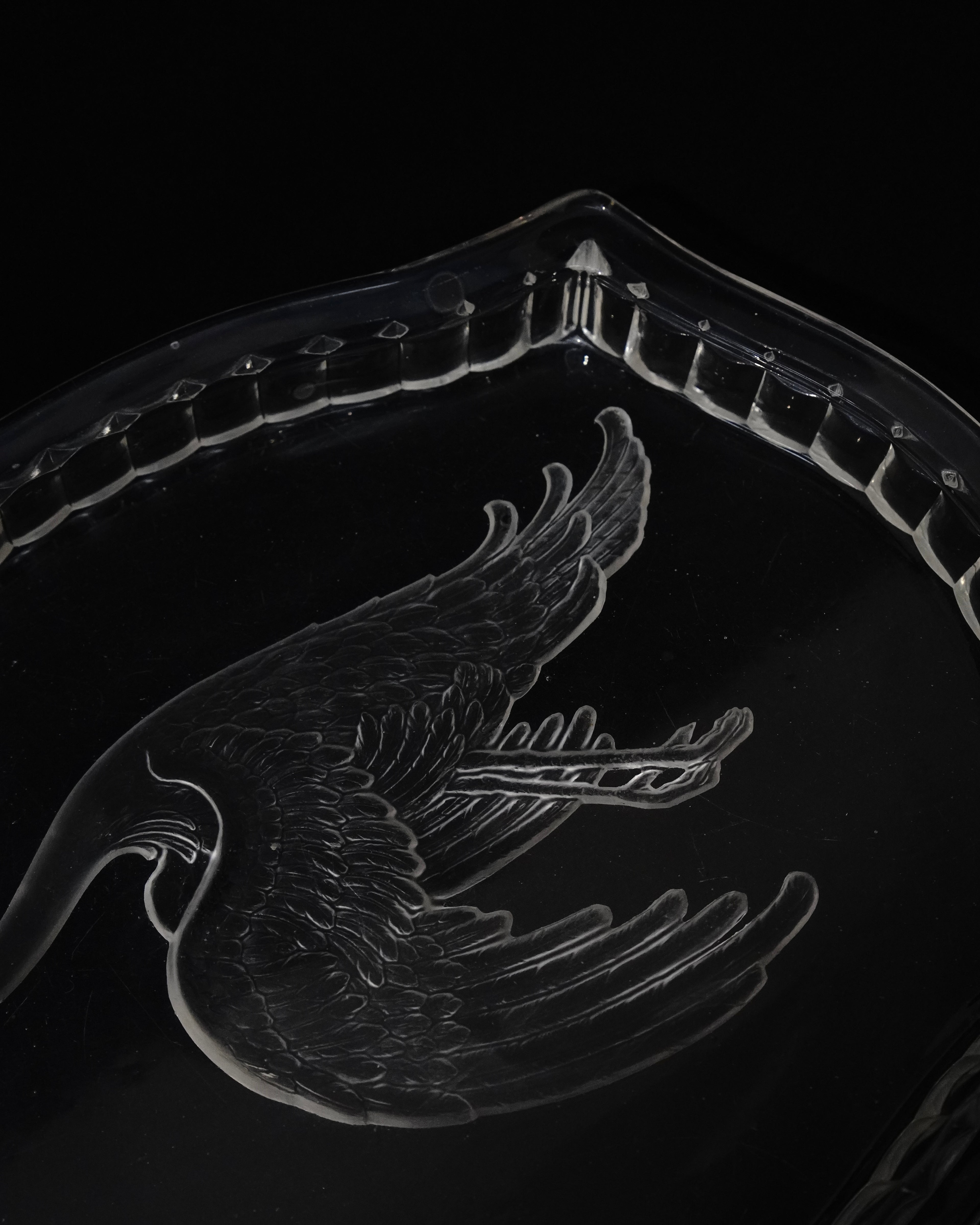 Glass tray with carved out crane