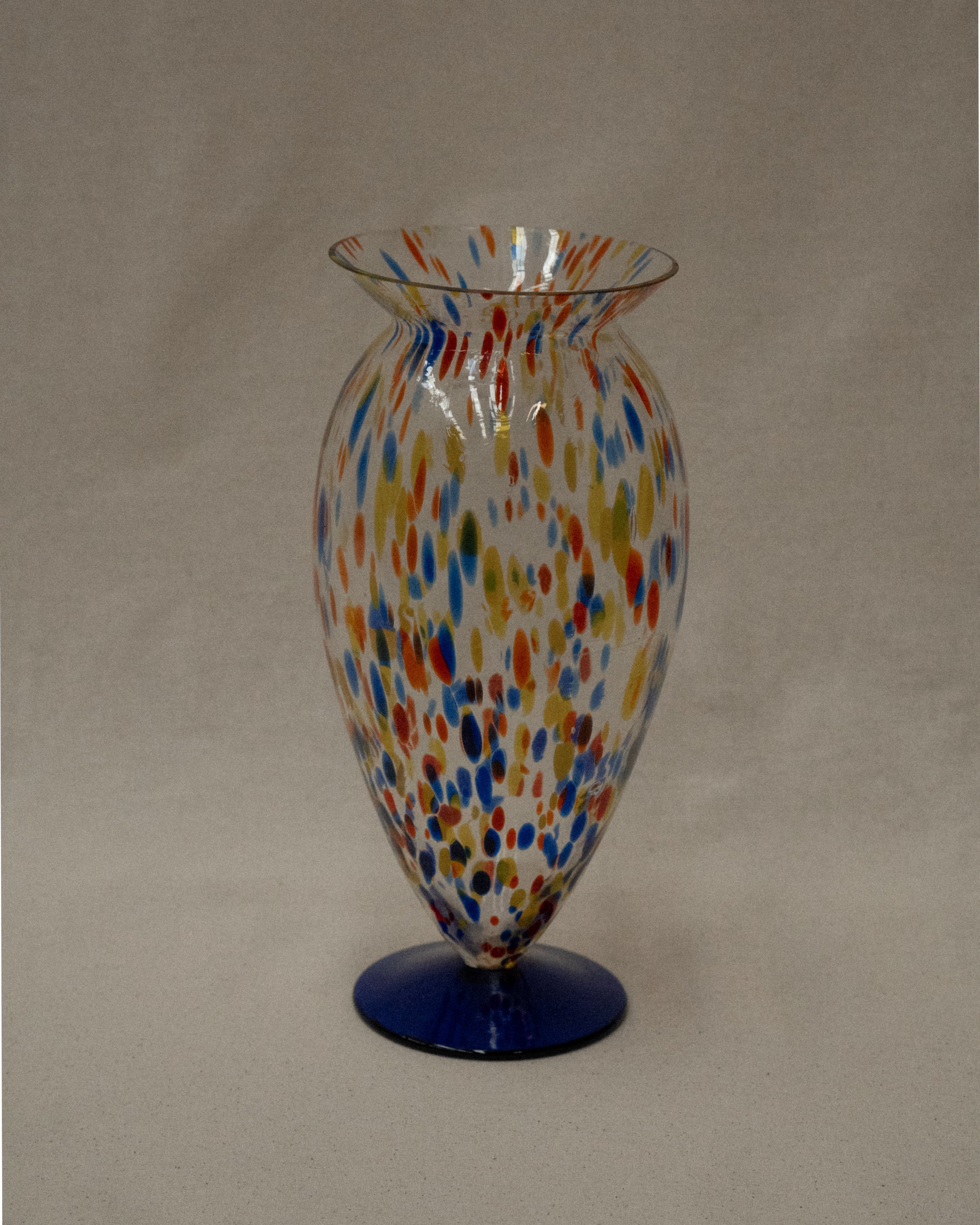 Art glass vase with colourful marks and blue base