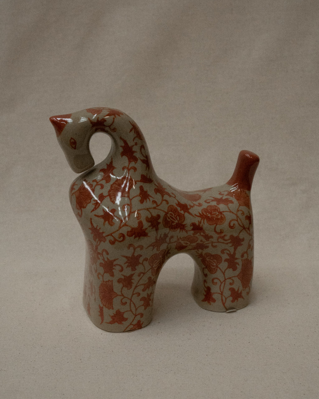 Pair of ceramic horses in pink and brown