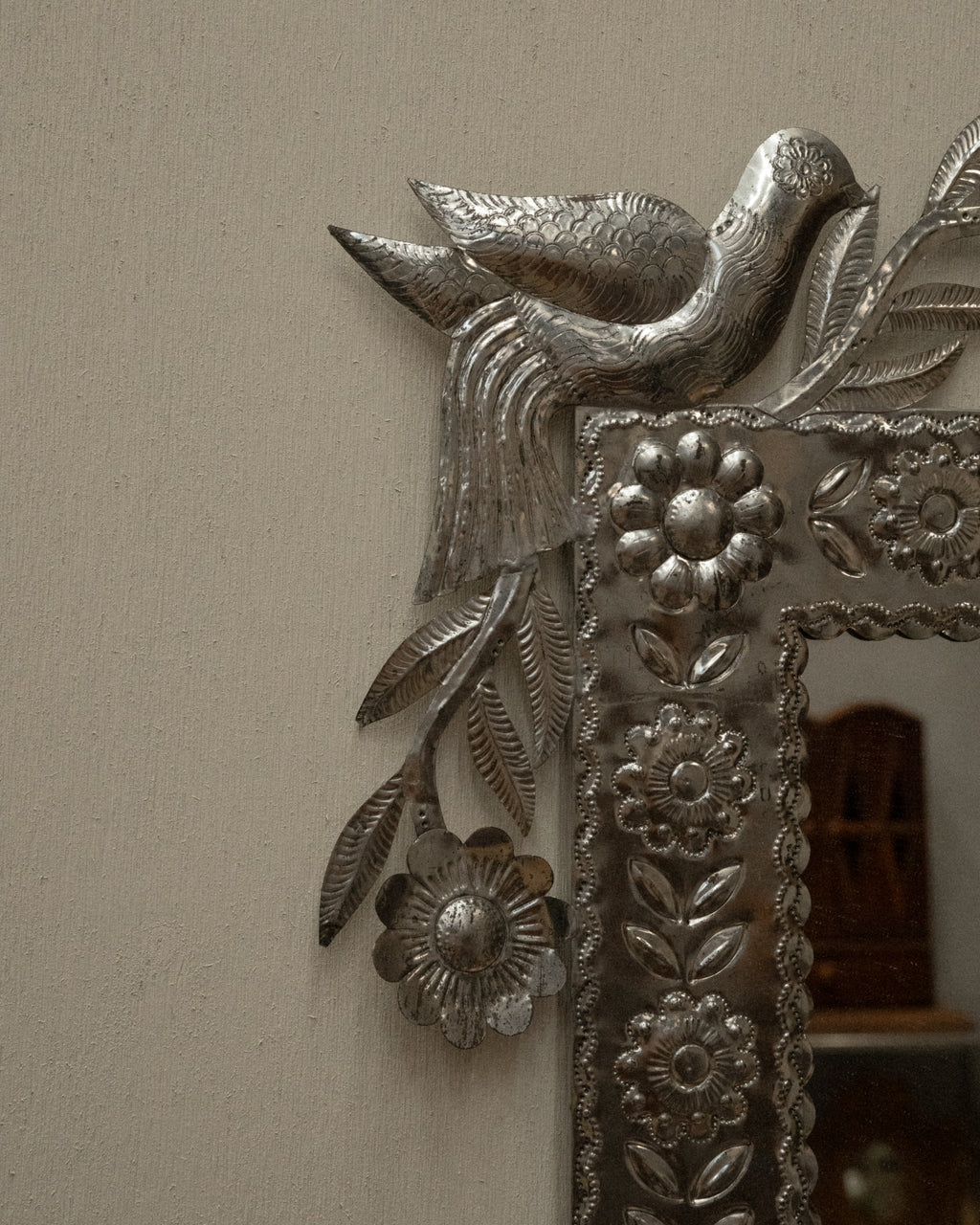 Mexican folk art punched tin mirror with pair of birds
