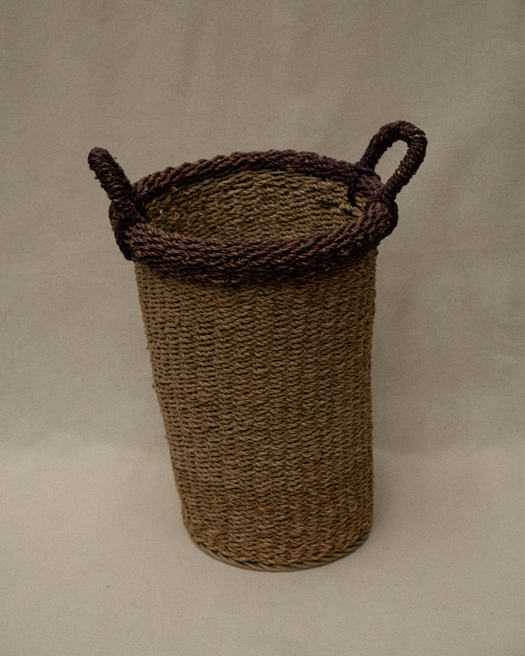 Seagrass woven basket with purple rim and handles