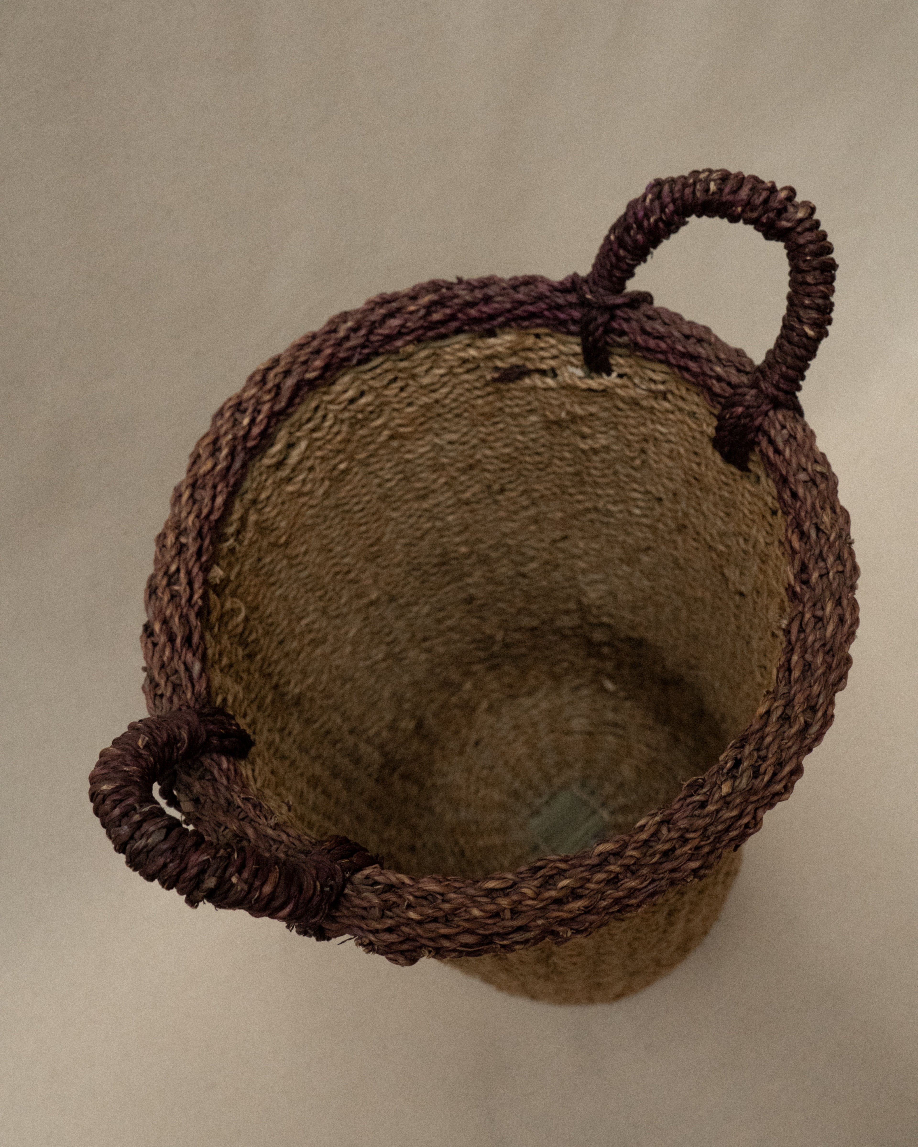 Seagrass woven basket with purple rim and handles
