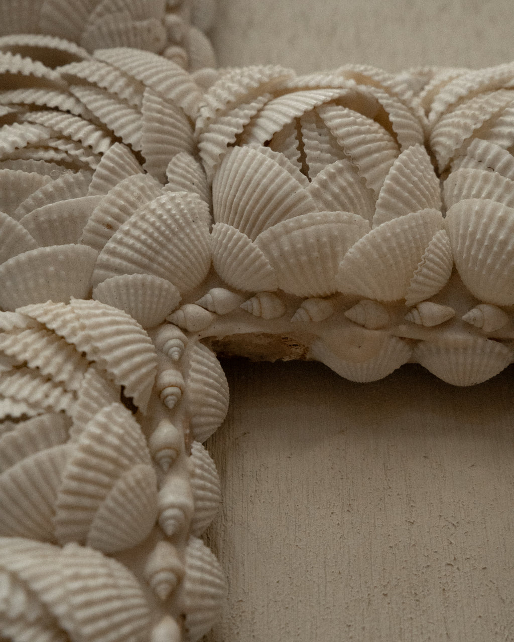 Cross wall hanging decorated with shells