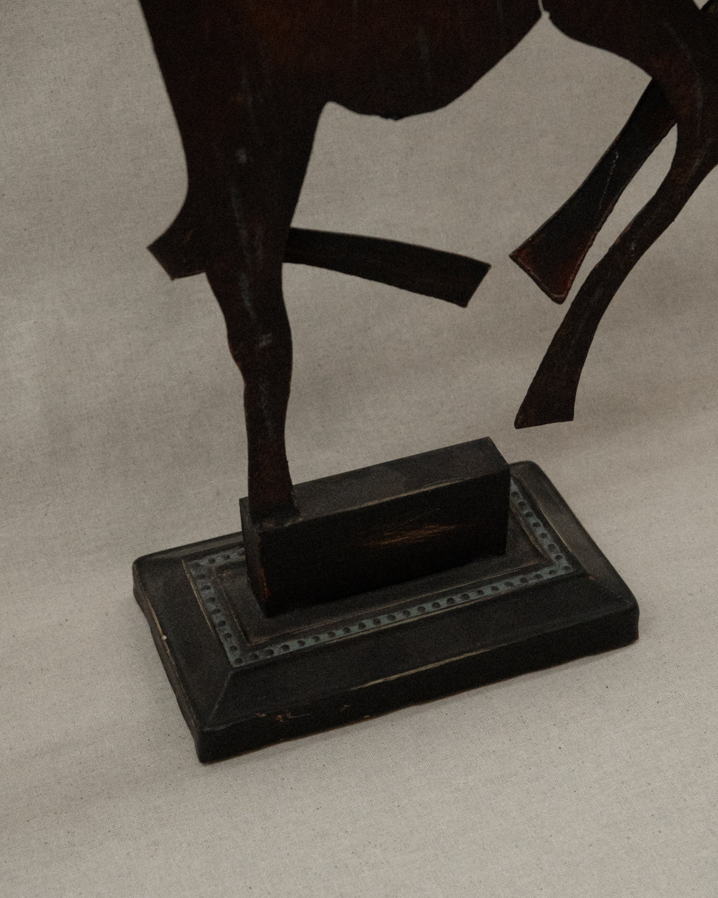 Brutalist metal horse sculpture with intentional patina