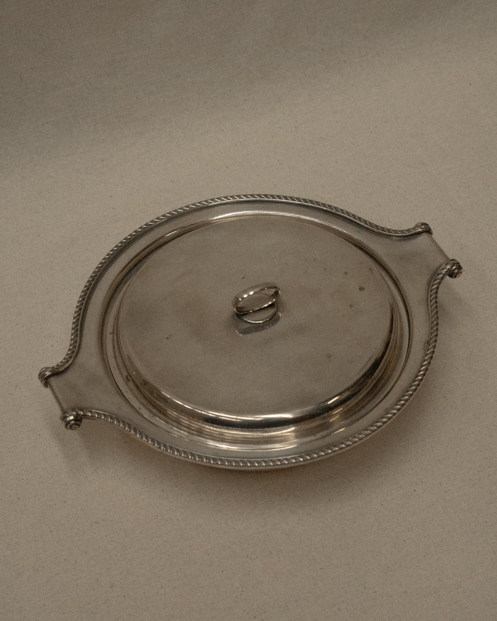 Silver plated lidded dish with scroll handles
