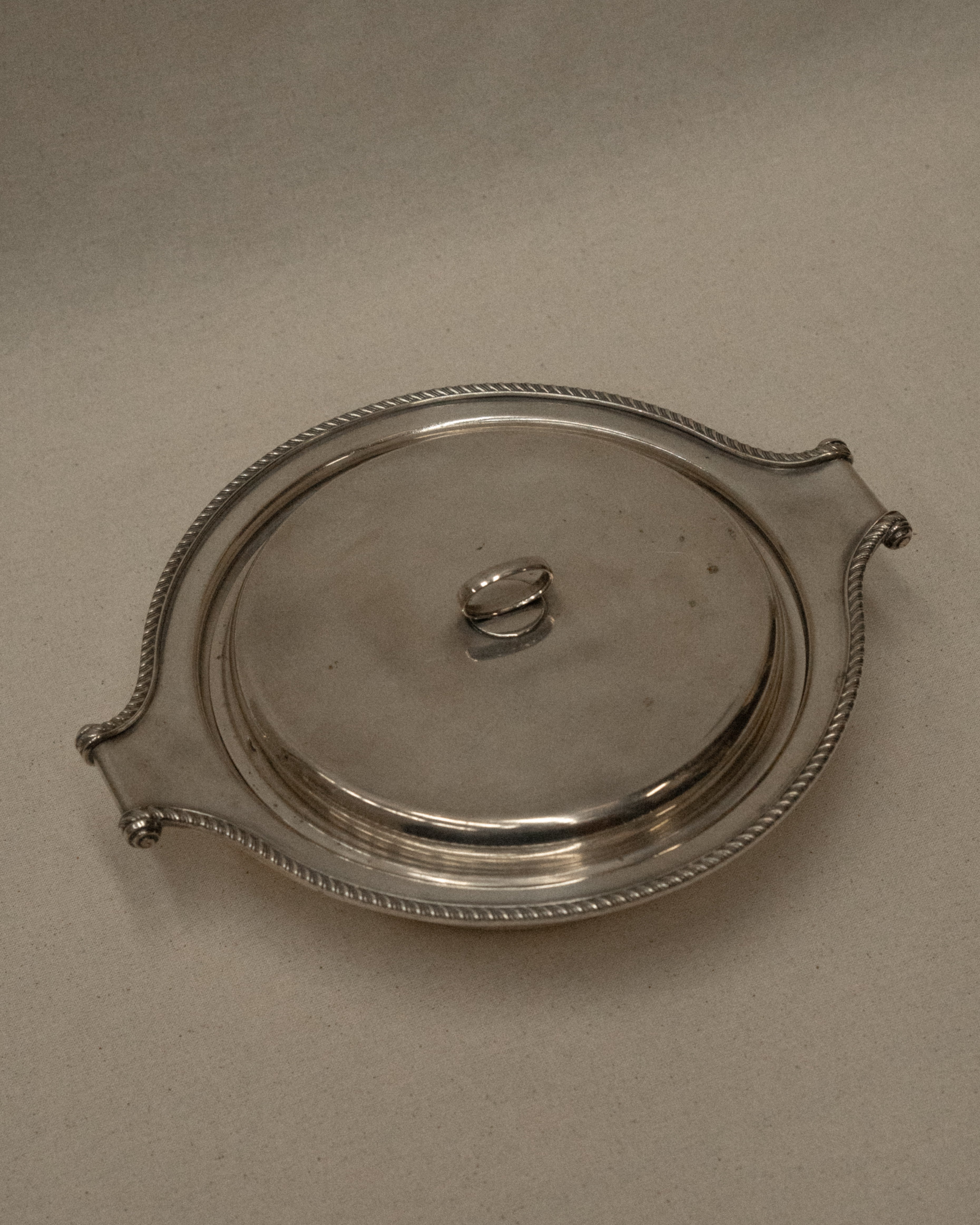 Silver plated lidded dish with scroll handles
