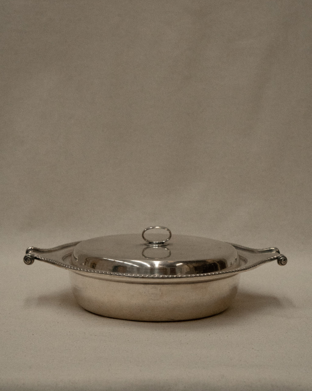 Silver plated lidded dish with scroll handles