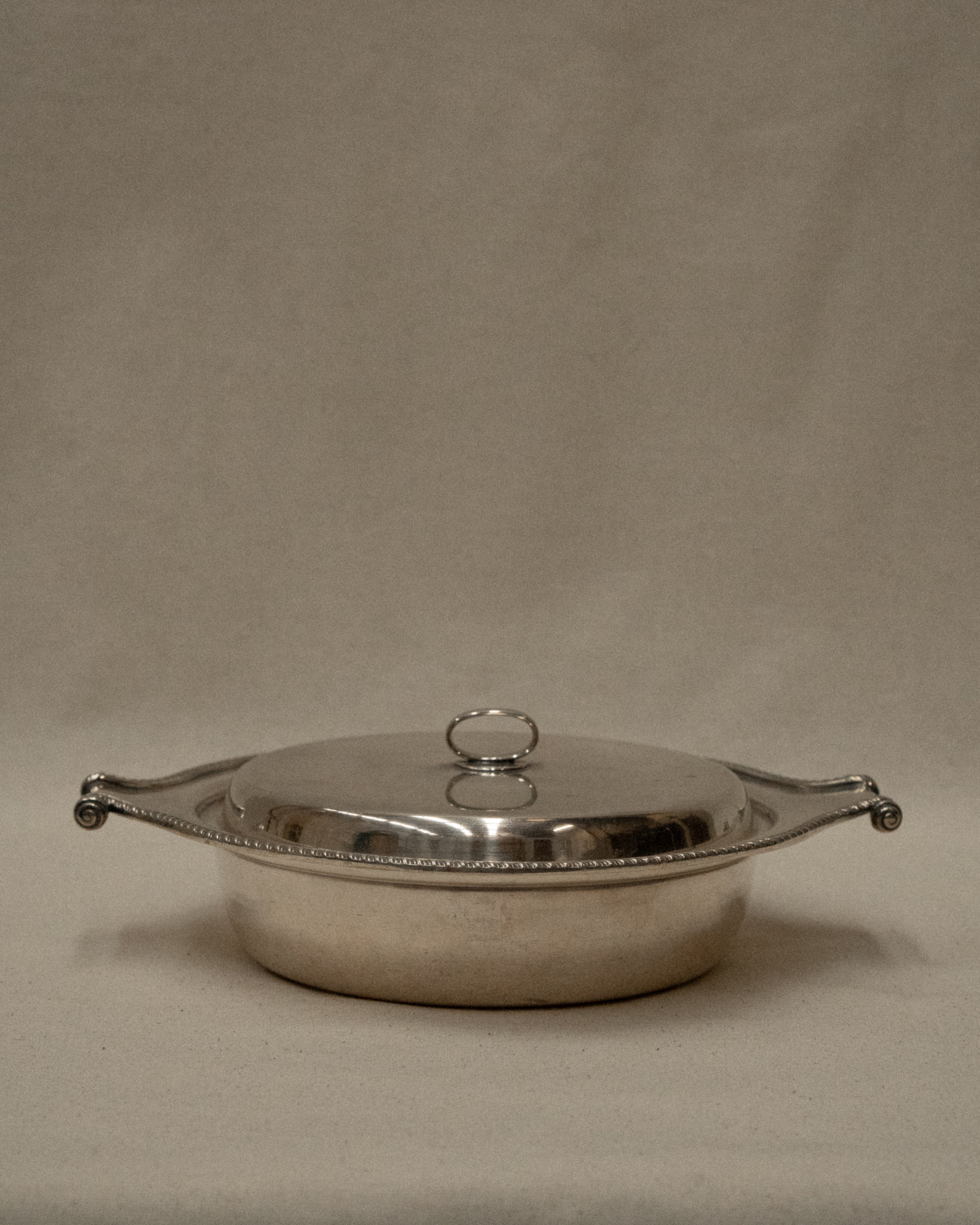 Silver plated lidded dish with scroll handles