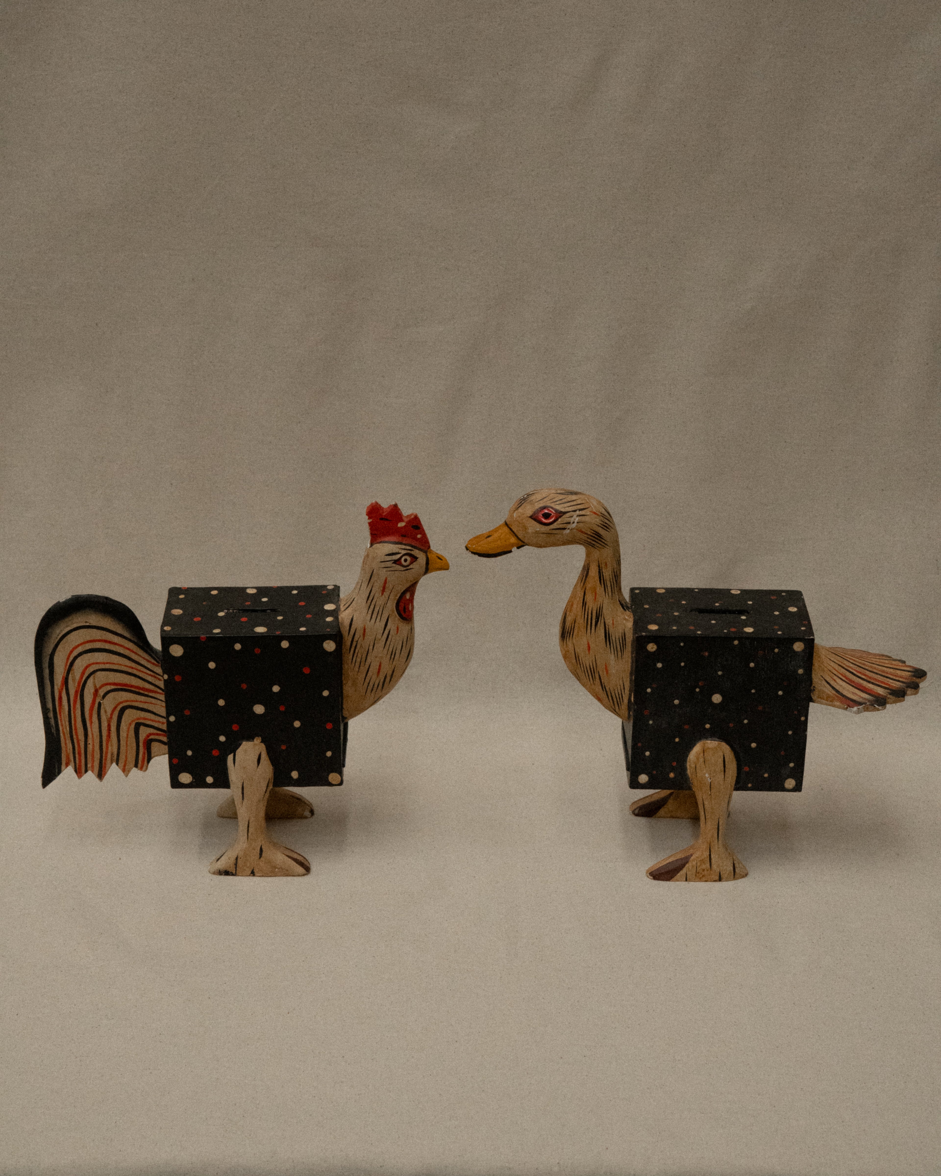 Pair of painted wooden chicken and duck coin box