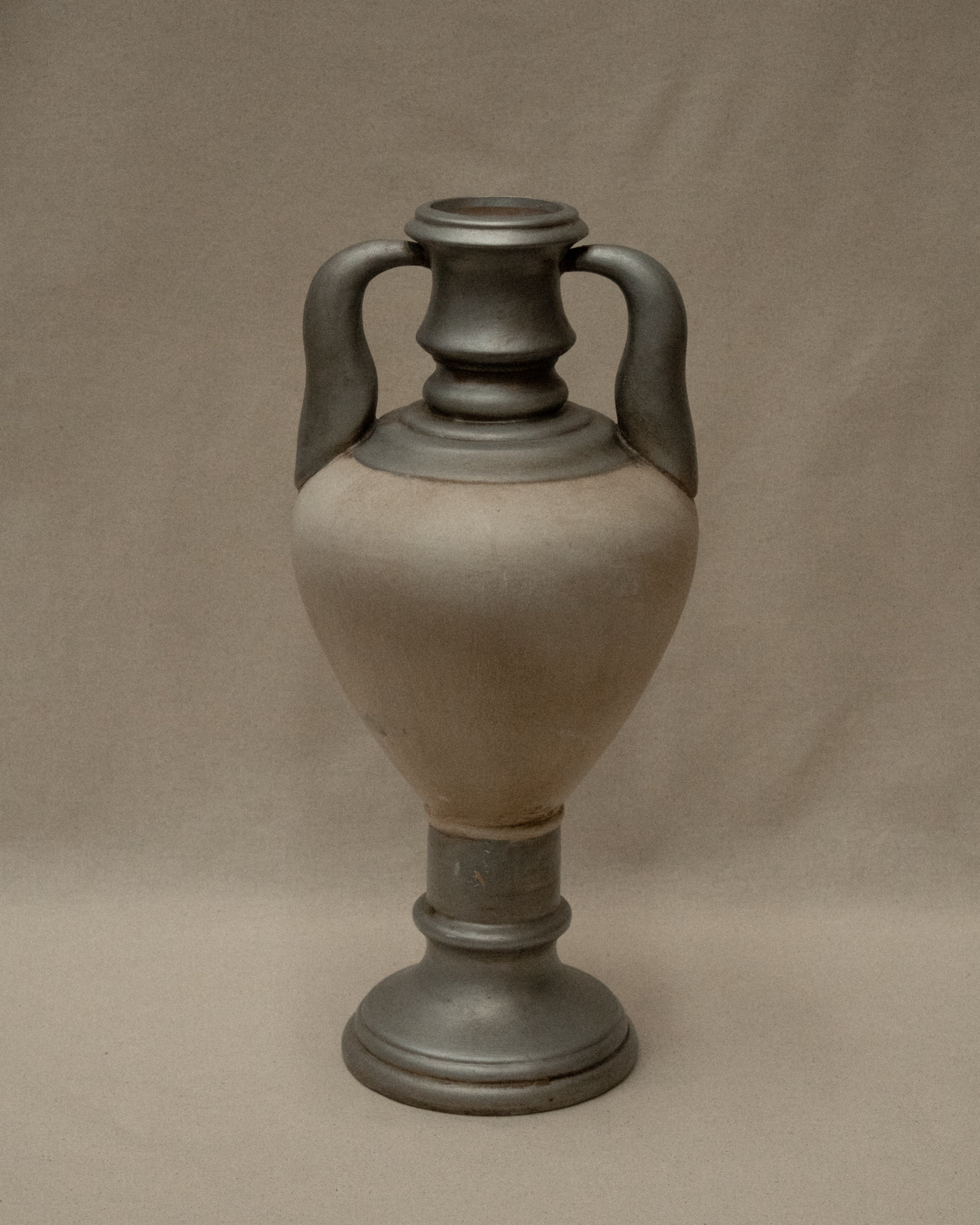 Silver and white painted terracotta vase