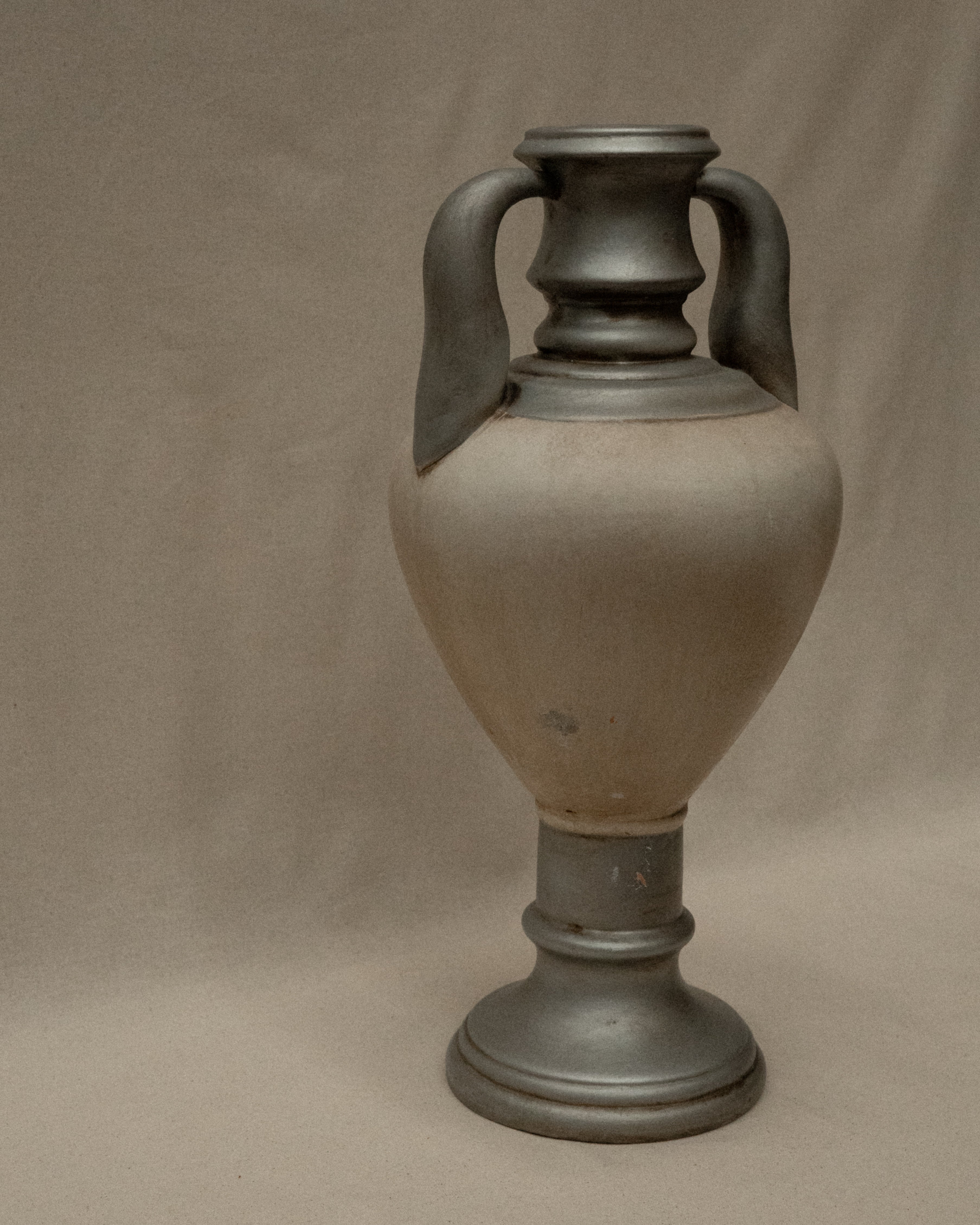 Silver and white painted terracotta vase