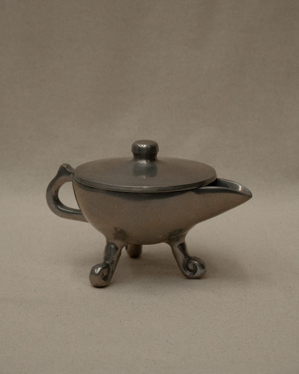 Aluminum teapot trinket holder with spiral feet